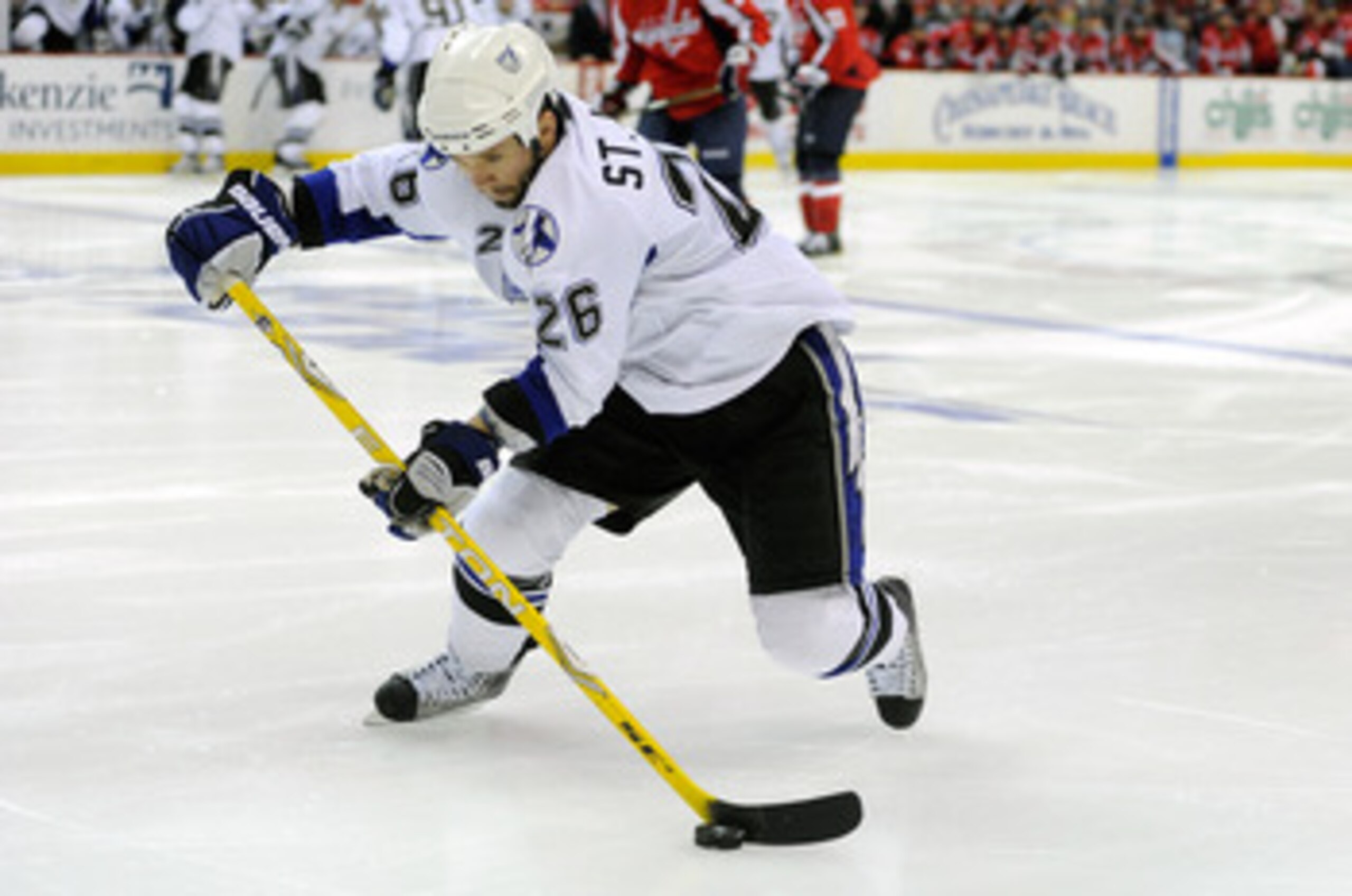 WASHINGTON, DC - MAY 01:  Martin St. Louis #26 of the Tampa Bay Lightning  brings the puck down the ice against the Washington Capitals during Game Two of the Eastern Conference Semifinal during the 2011 NHL Stanley Cup Playoffs at the Verizon Center on M