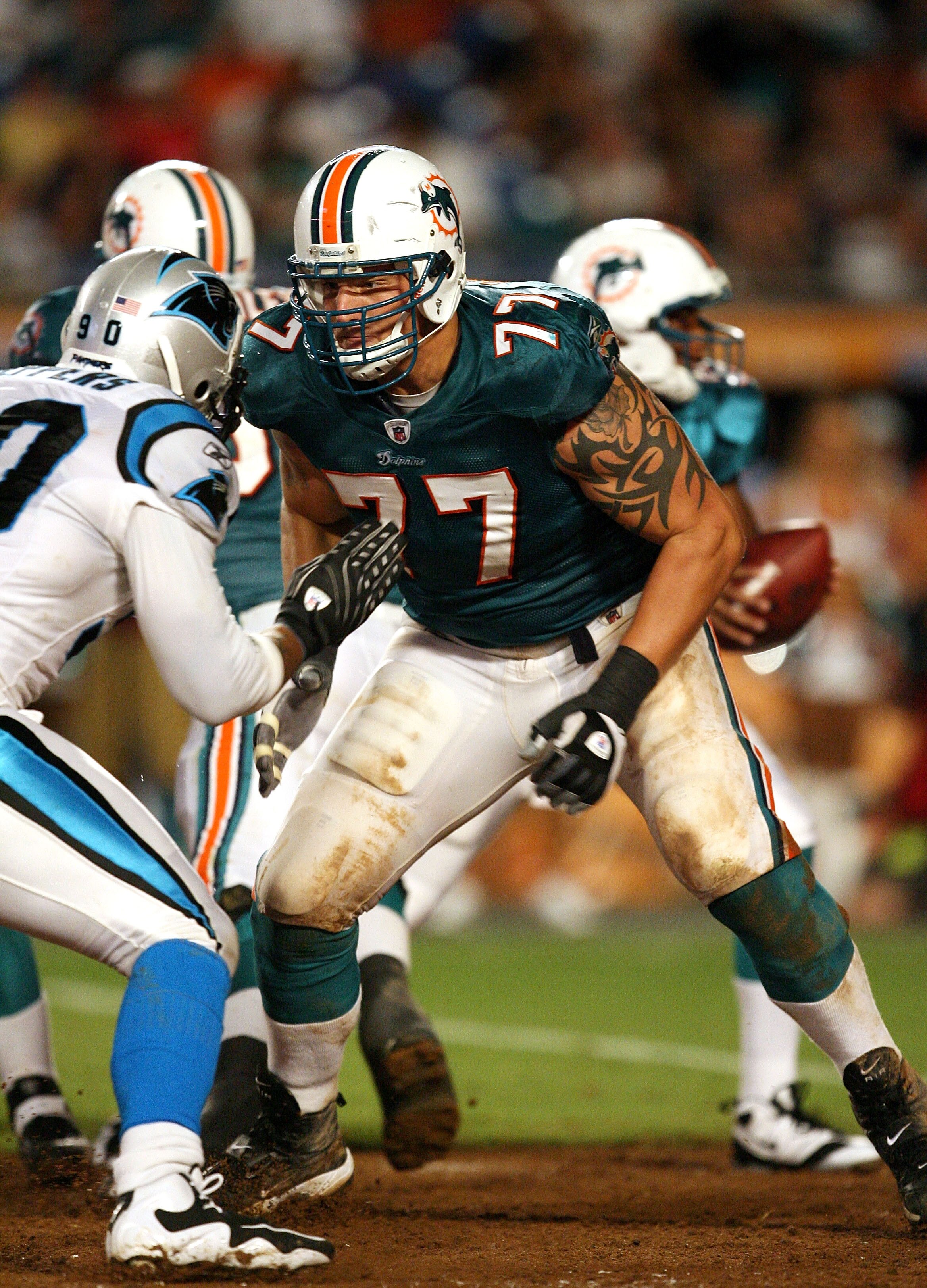 MIAMI - AUGUST 22:  Offensive lineman Jake Long #77 of the Miami Dolphins drops back to block against the Carolina Panthers during a pre-season game at Land Shark Stadium on August 22, 2009 in Miami, Florida. The Dolphins defeated the Panthers 27-17.  (Ph