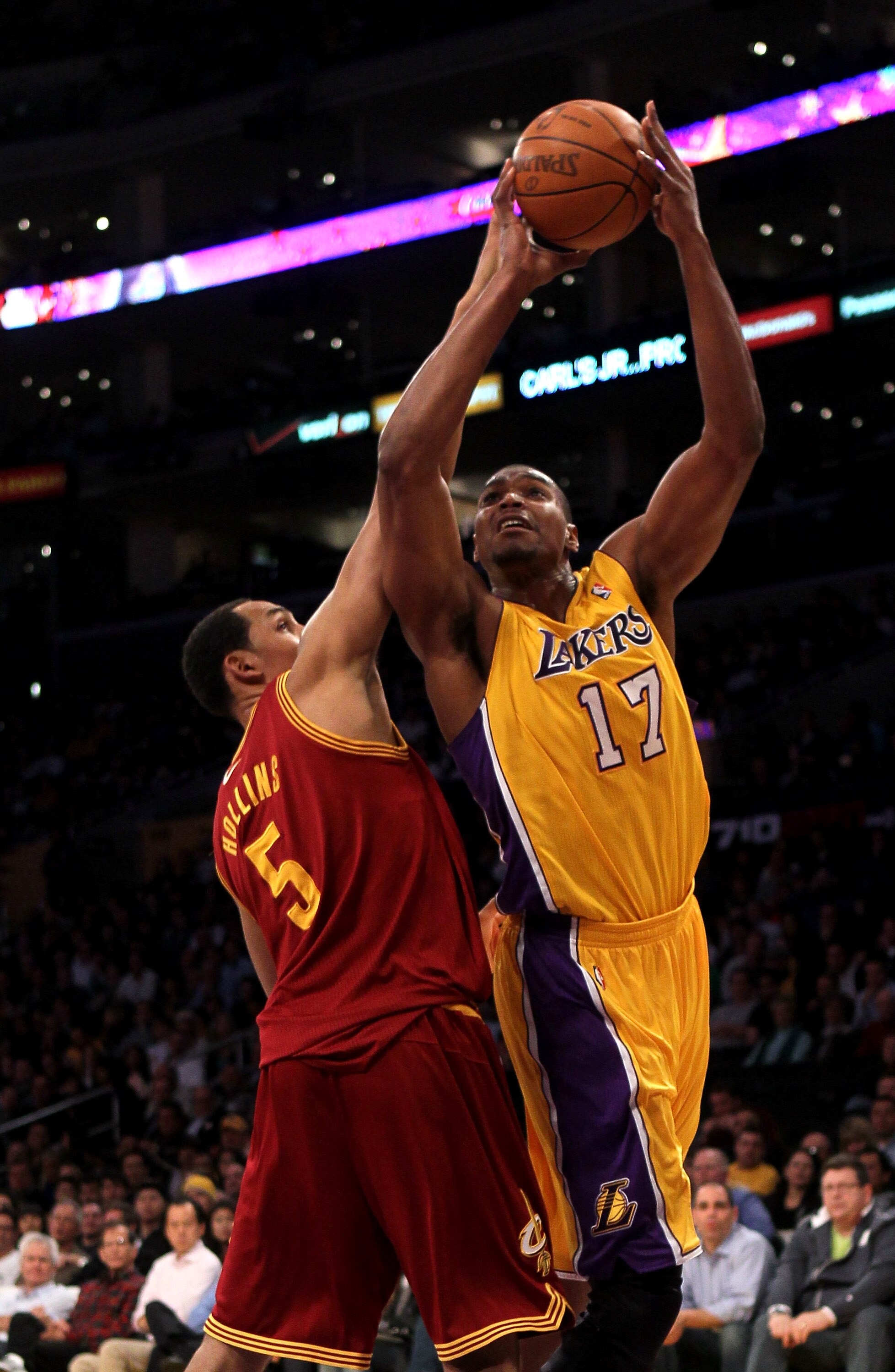 LOS ANGELES, CA - JANUARY 11:   Andrew Bynum #17 of the Los Angeles Lakers shoots over Ryan Hollins #5 the Cleveland Cavaliers at Staples Center on January 11, 2011 in Los Angeles, California.   NOTE TO USER: User expressly acknowledges and agrees that, b