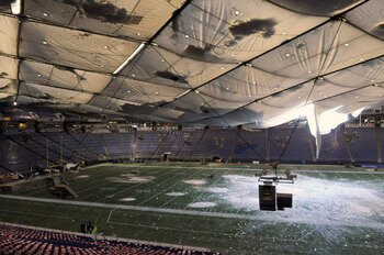MINNEAPOLIS, MN - DECEMBER 13: A torn section of the roof sags inside the Hubert H. Humphrey Metrodome on December 13, 2010 in Minneapolis, Minnesota. The Metrodome's roof collapsed under the weight of snow after a powerful blizzard hit the area on Decemb