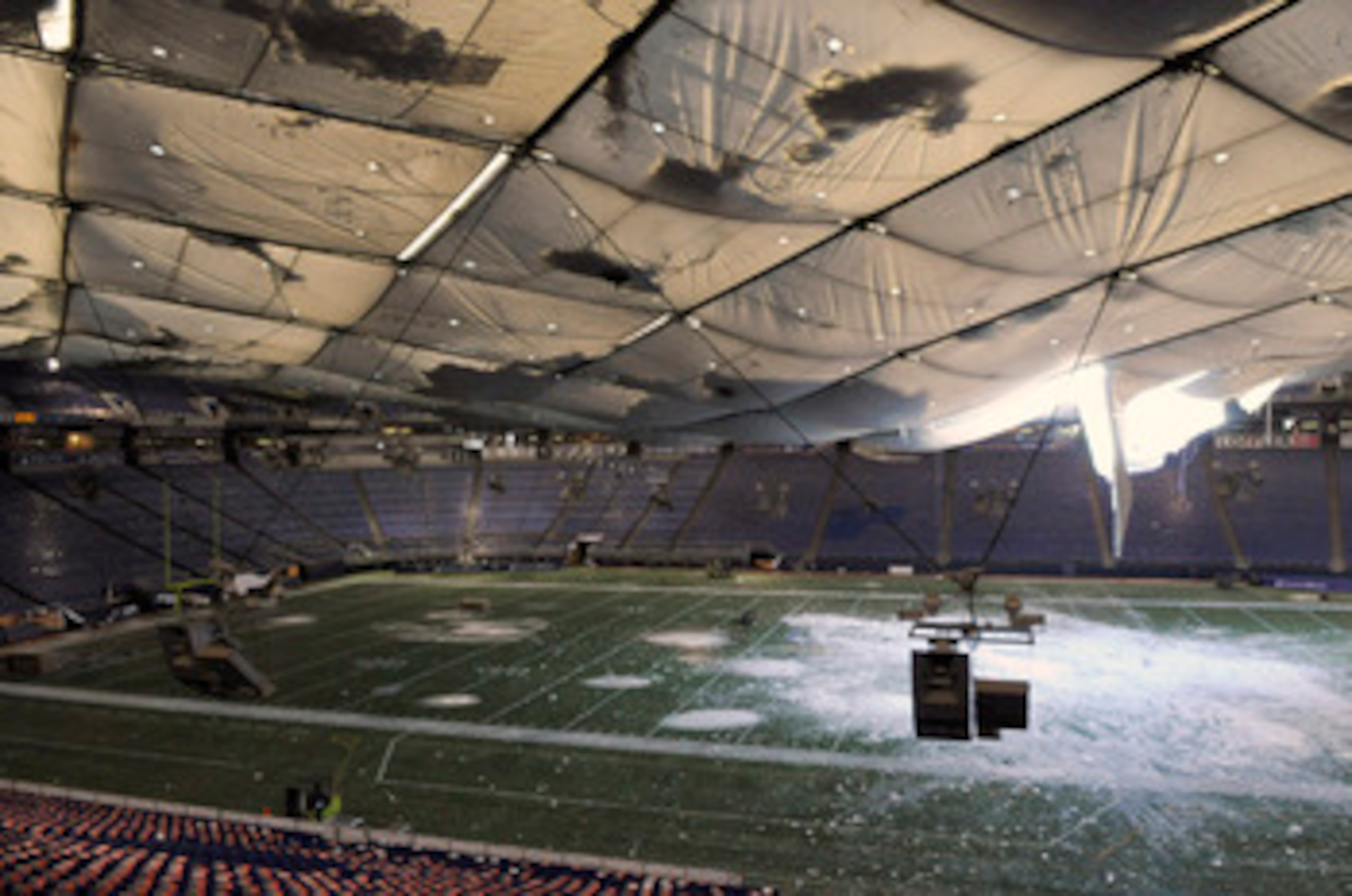 MINNEAPOLIS, MN - DECEMBER 13: A torn section of the roof sags inside the Hubert H. Humphrey Metrodome on December 13, 2010 in Minneapolis, Minnesota. The Metrodome's roof collapsed under the weight of snow after a powerful blizzard hit the area on Decemb