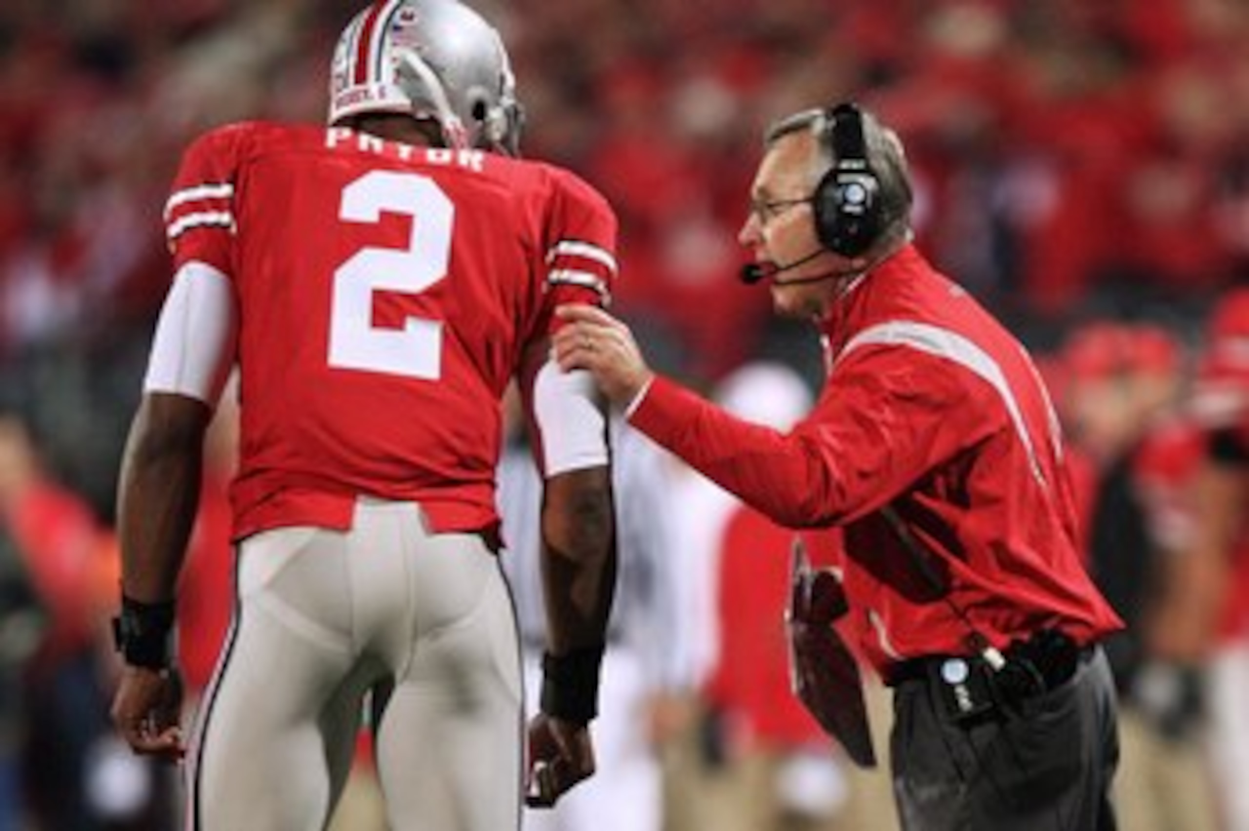 COLUMBUS, OH - OCTOBER 25: Ohio State Buckeyes head coach Jim Tressell instructs his quarterback Terrell Pryor #2 during the game against the Penn State Nittany Lions on October 25, 2008 at Ohio Stadium in Columbus, Ohio.  (Photo by Jamie Sabau/Getty Imag