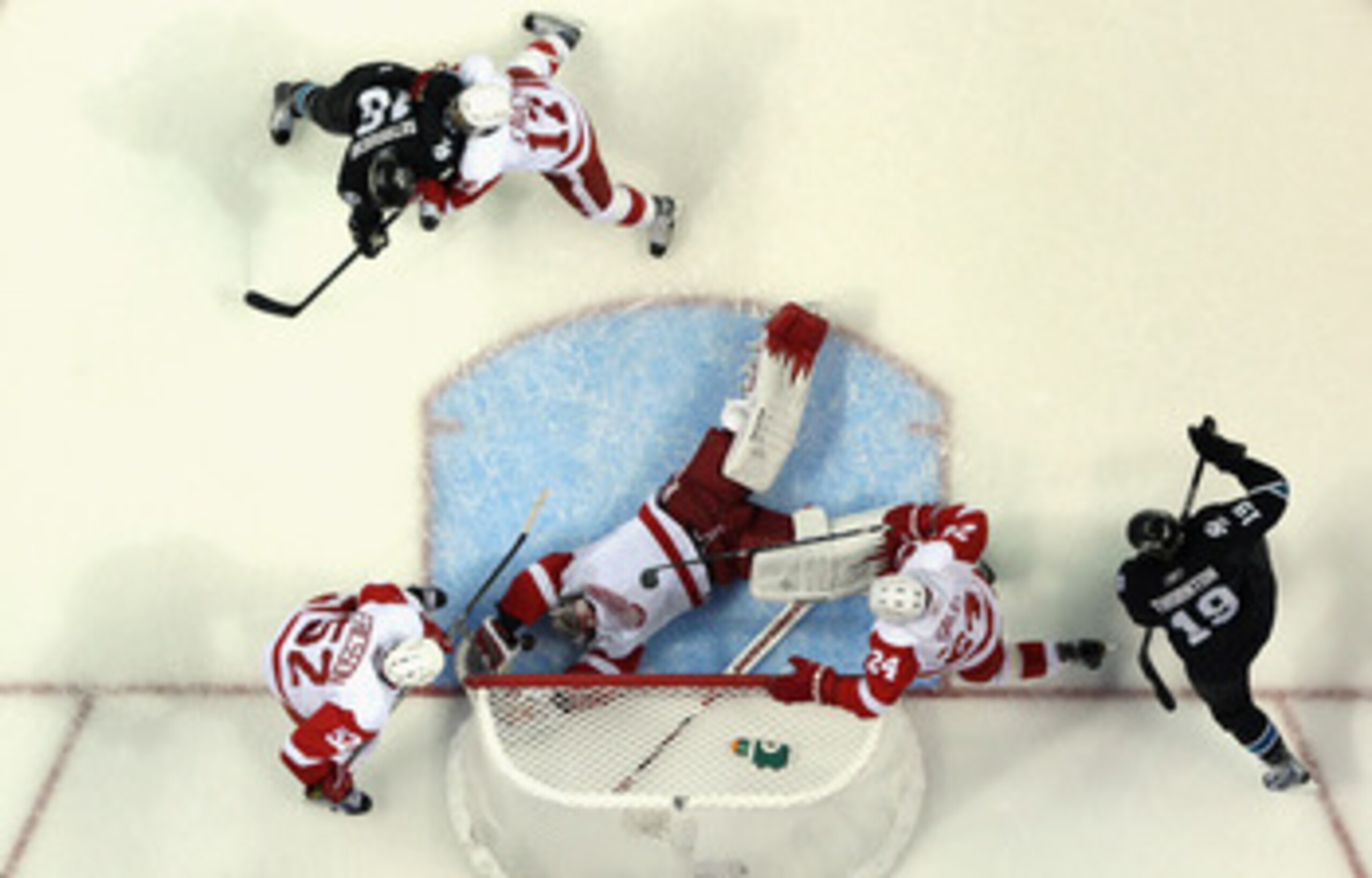 SAN JOSE, CA - MAY 01:  Jimmy Howard #35 of the Detroit Red Wings makes a diving save in the second period of their game against the San Jose Sharks in Game Two of the Western Conference Semifinals during the 2011 NHL Stanley Cup Playoffs at HP Pavilion o