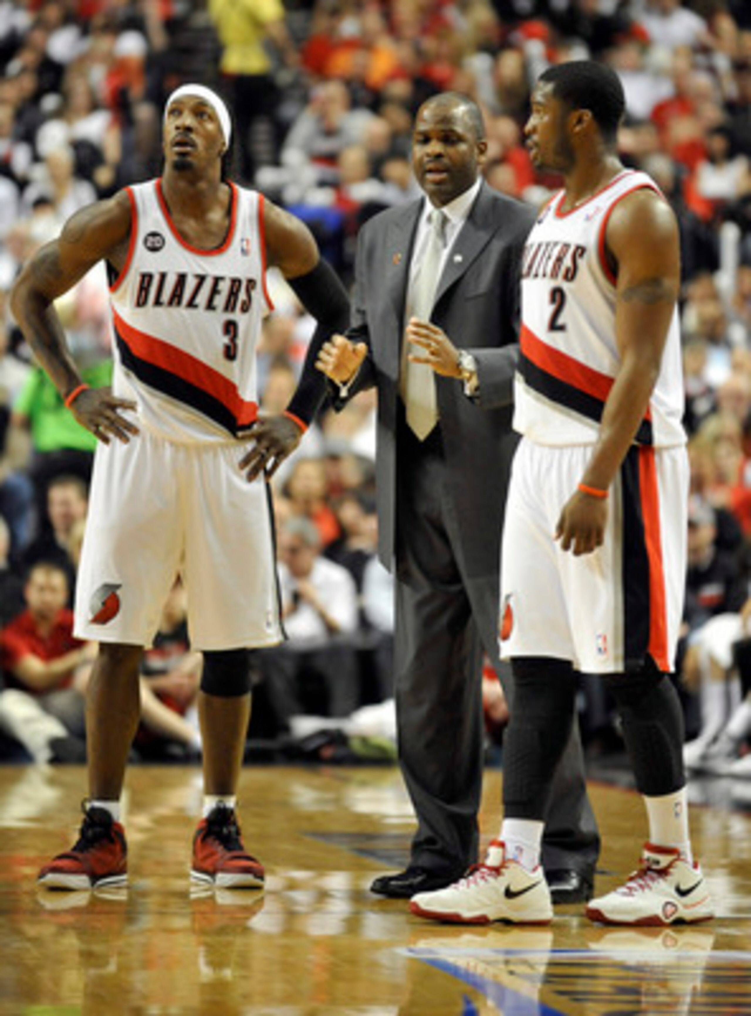 PORTLAND, OR - APRIL 28: (L to R) Gerald Wallace #3, head coach Nate McMillan and Wes Matthews #2 of the Portland Trail Blazers gather during a time out in the fourth quarter of Game Six of the Western Conference Quartefinals in the 2011 NBA Playsoffs on