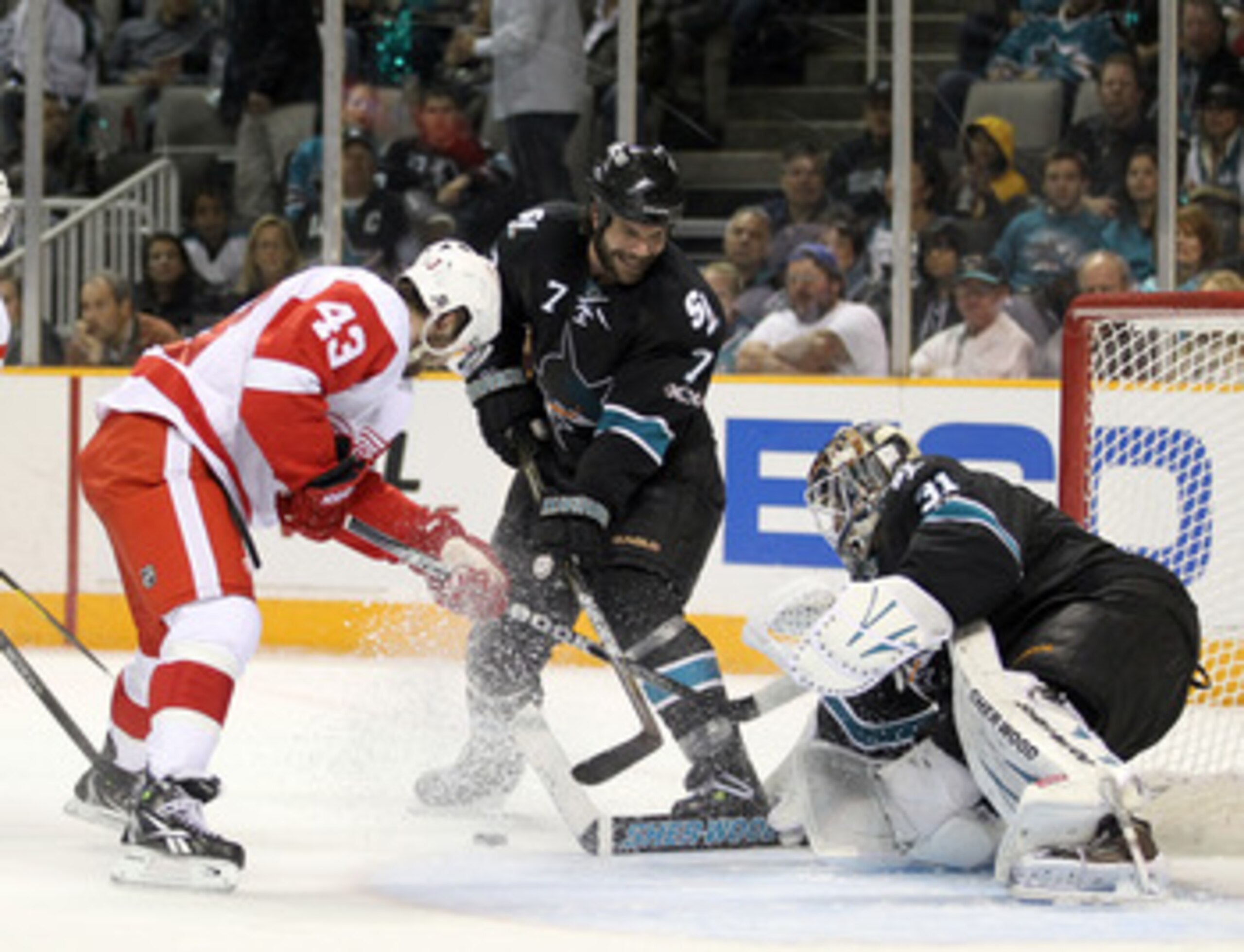 SAN JOSE, CA - APRIL 29:  Niclas Wallin #7 and Antti Niemi #31 of the San Jose Sharks stop Darren Helm #43 of the Detroit Red Wings in Game One of the Western Conference Semifinals during the 2011 NHL Stanley Cup Playoffs at HP Pavilion on April 29, 2011