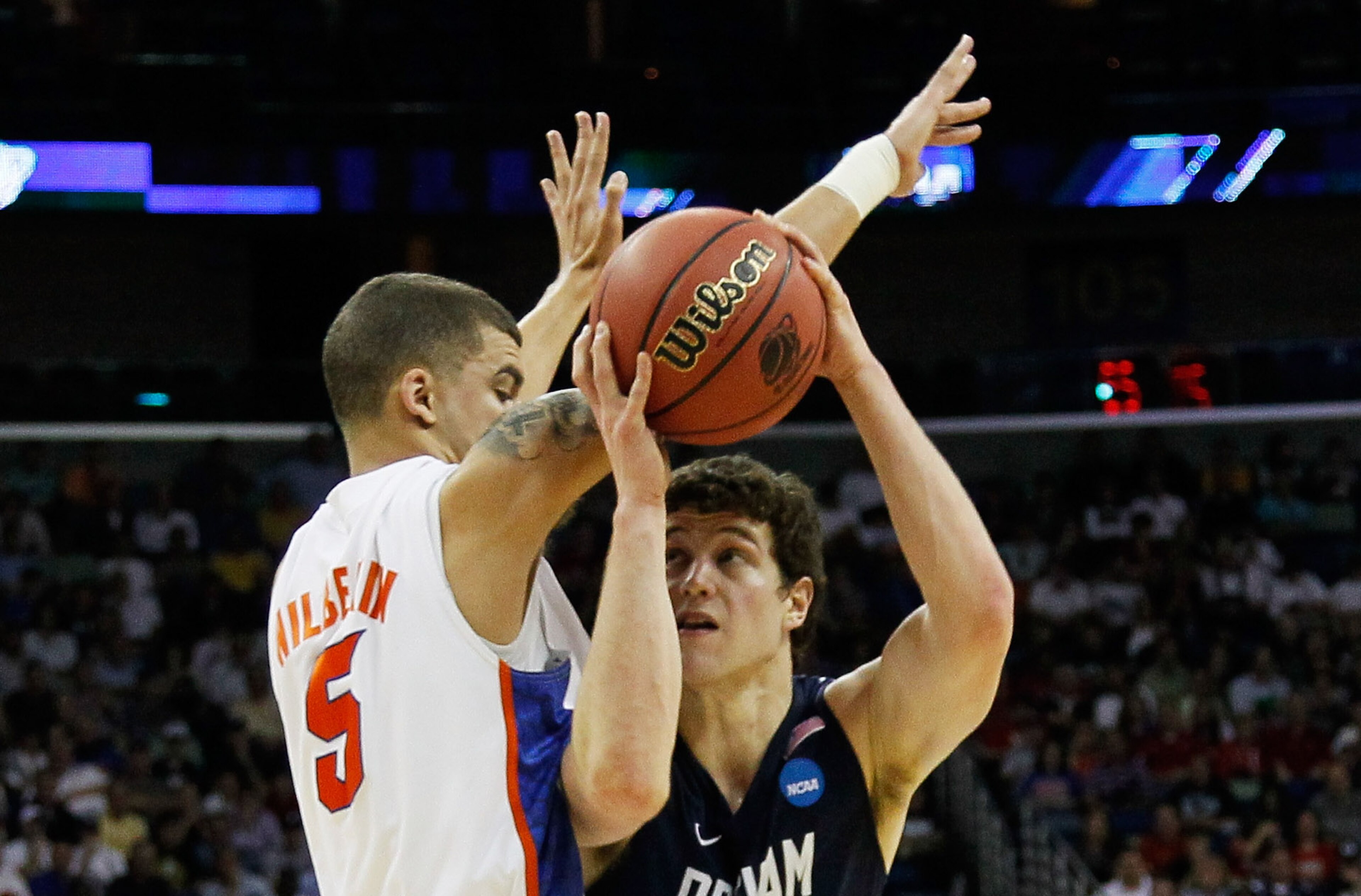 NEW ORLEANS, LA - MARCH 24:  Jimmer Fredette #32 of the Brigham Young Cougars goes up against Scottie Wilbekin #5 of the Florida Gators during the Southeast regional of the 2011 NCAA men's basketball tournament at New Orleans Arena on March 24, 2011 in Ne