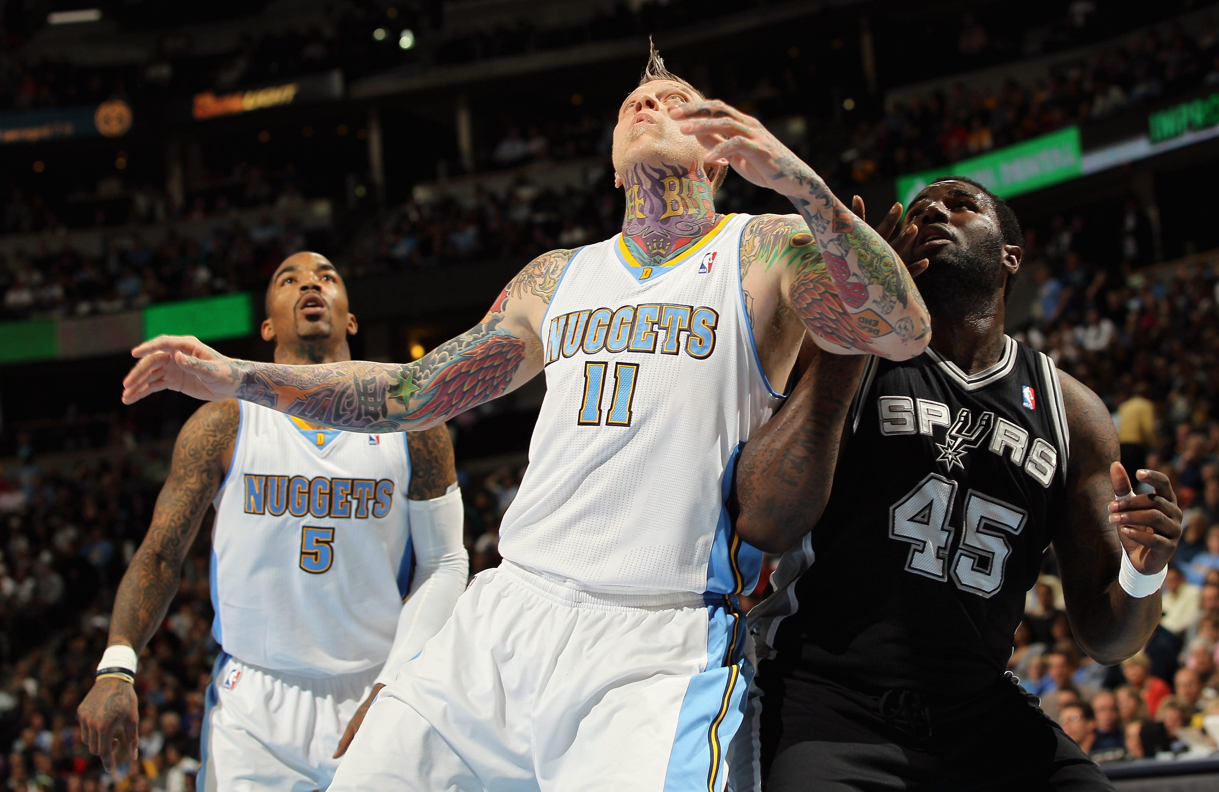 DENVER, CO - MARCH 23:  Chris Andersen #11 of the Denver Nuggets battle for position with DeJuan Blair #45 of the San Antonio Spurs at the Pepsi Center on March 23, 2011 in Denver, Colorado. The Nuggets defeated the Spurs 115-112. NOTE TO USER: User expre