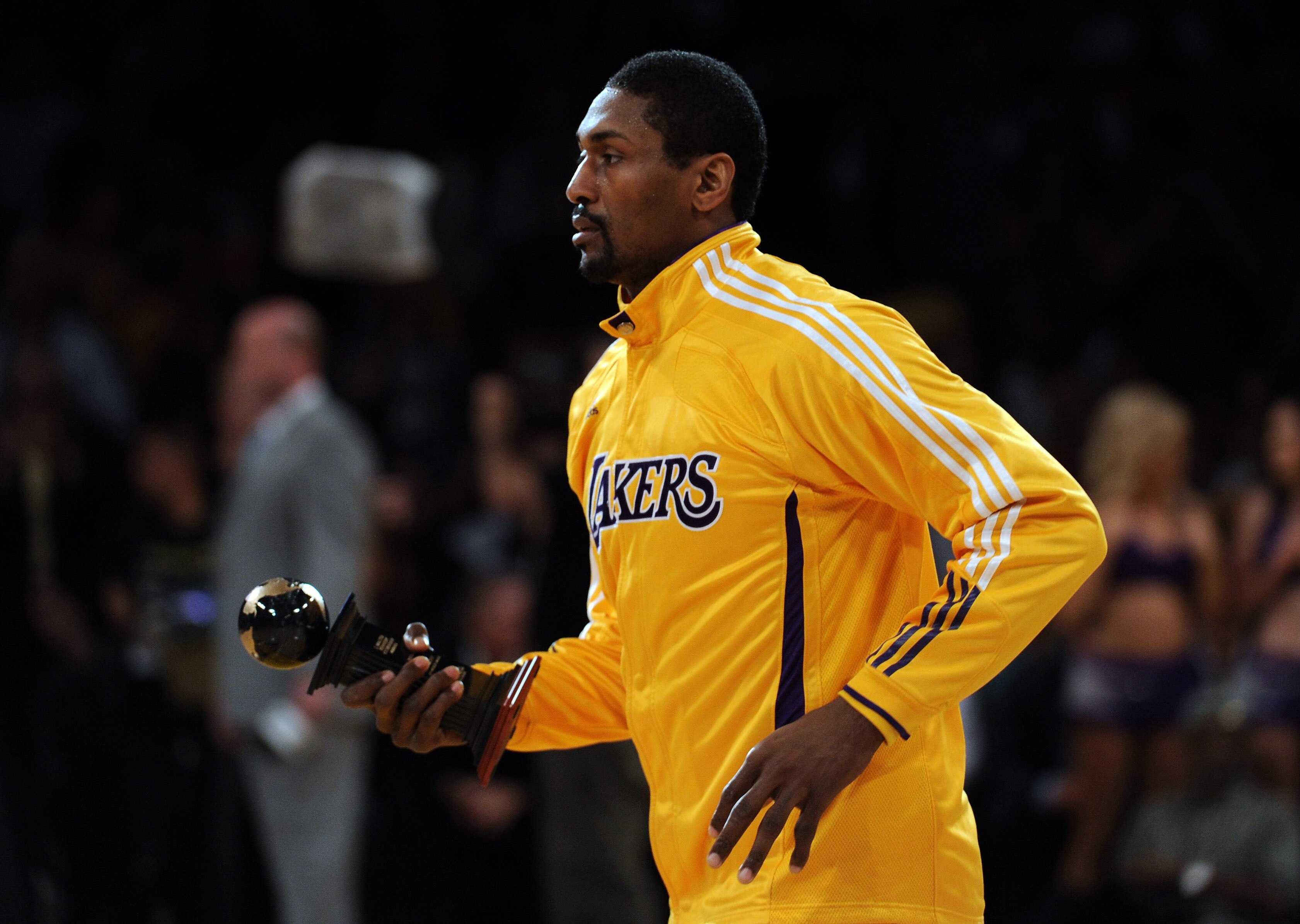 LOS ANGELES, CA - APRIL 26:  Ron Artest #15 of the Los Angeles Lakers is presented with the J. Walter Kennedy Citizenship Award for his charitable efforts before taking on the New Orleans Hornets in Game Five of the Western Conference Quarterfinals in the