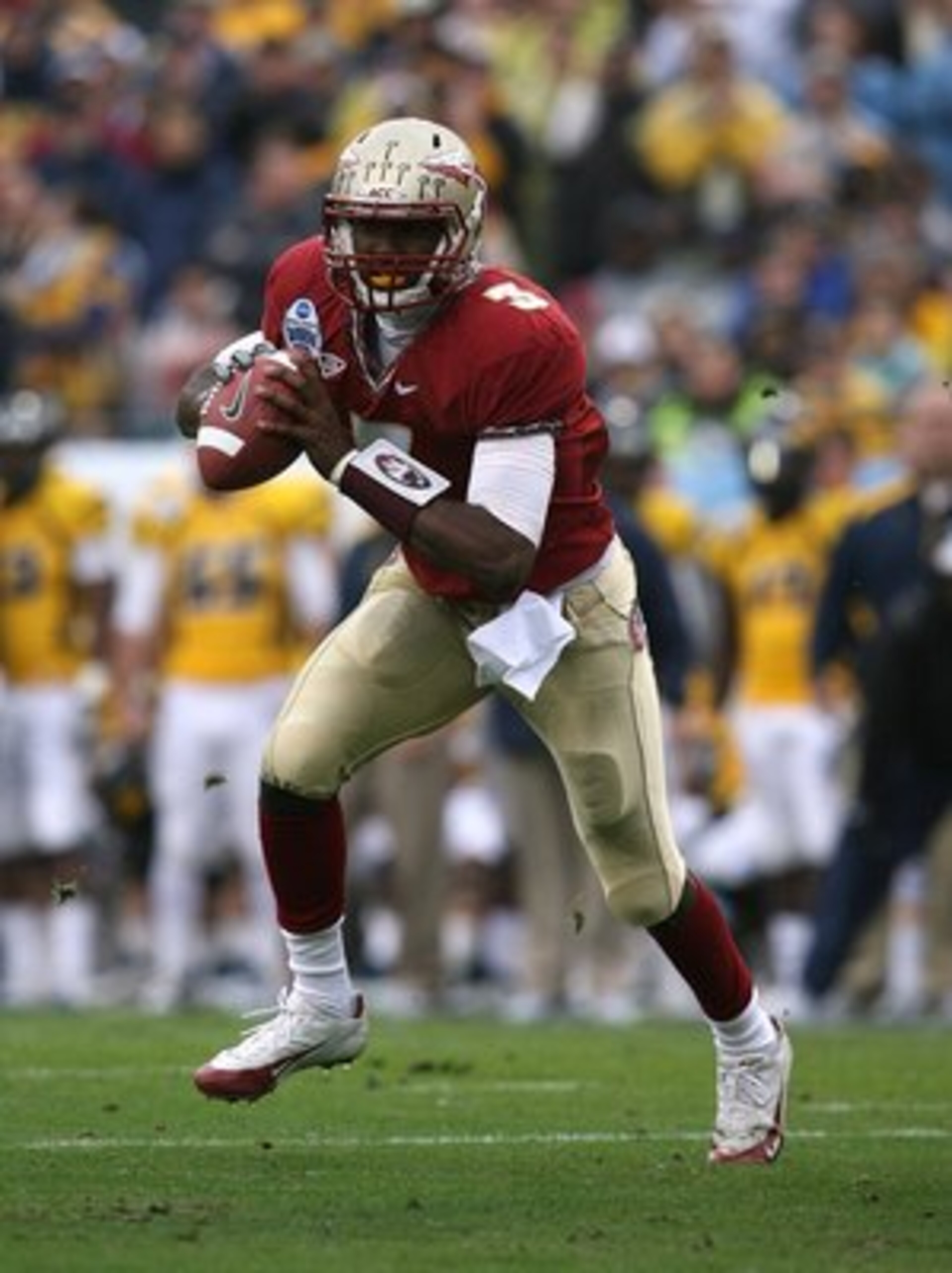 JACKSONVILLE, FL - JANUARY 01: Quarterback E.J. Manuel #3 of the Florida State Seminoles scrambles against the West Virginia Mountaineers during the Konica Minolta Gator Bowl on January 1, 2010 at Jacksonville Municipal Stadium in Jacksonville, Florida. JACKSONVILLE, FL - JANUARY 01: Quarterback E.J. Manuel #3 of the Florida State Seminoles scrambles against the West Virginia Mountaineers during the Konica Minolta Gator Bowl on January 1, 2010 at Jacksonville Municipal Stadium in Jacksonville, Florida.
