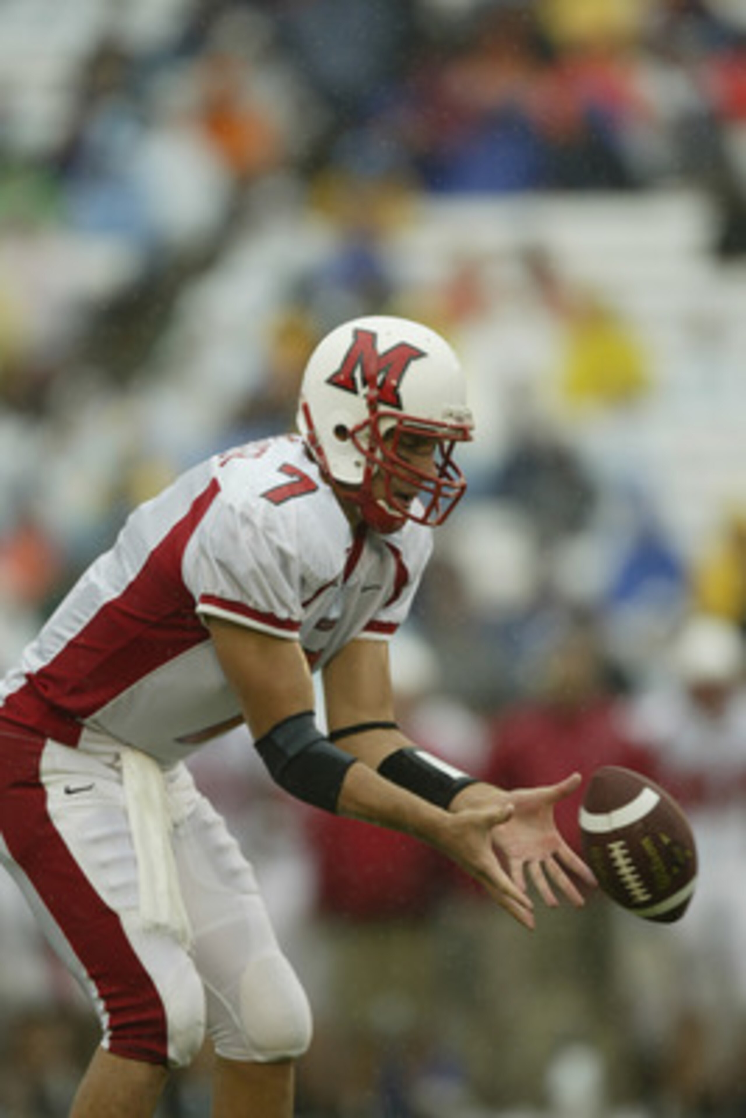 CHAPEL HILL, NC - AUGUST 31:  Quarterback Ben Roethlisberger #7 of the Miami of Ohio Redhawks grabs the snap during the NCAA football game against the UNC Tar Heels at Kenan Stadium in Chapel Hill, North Carolina  on August 31, 2002.  The Miami of Ohio Re