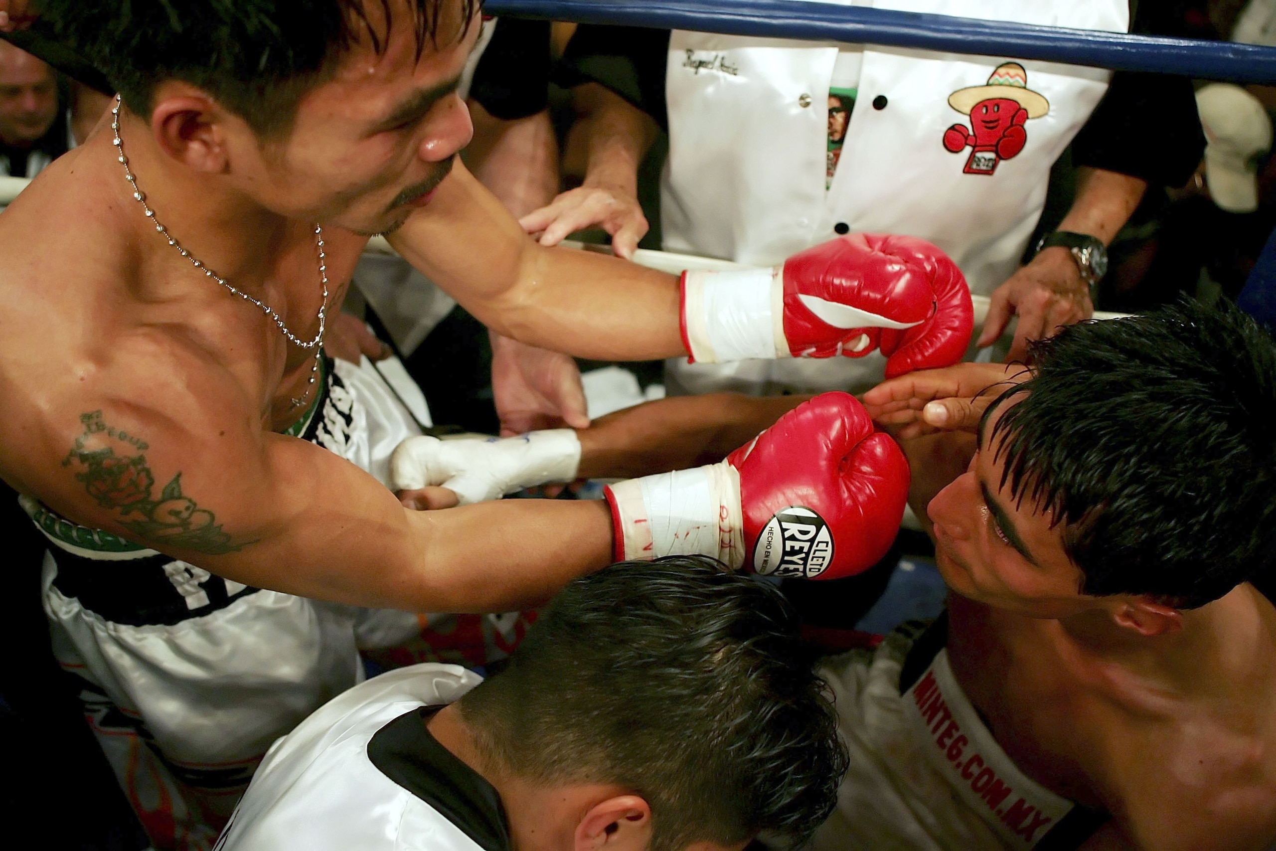 LAS VEGAS - NOVEMBER 18:  (L-R) Manny Pacquiao of the Philippines goes over to hug Erik Morales of Mexico after their super featherweight bout at the Thomas & Mack Center on November 18, 2006 in Las Vegas, Nevada. Pacquiao won after a third round knockout