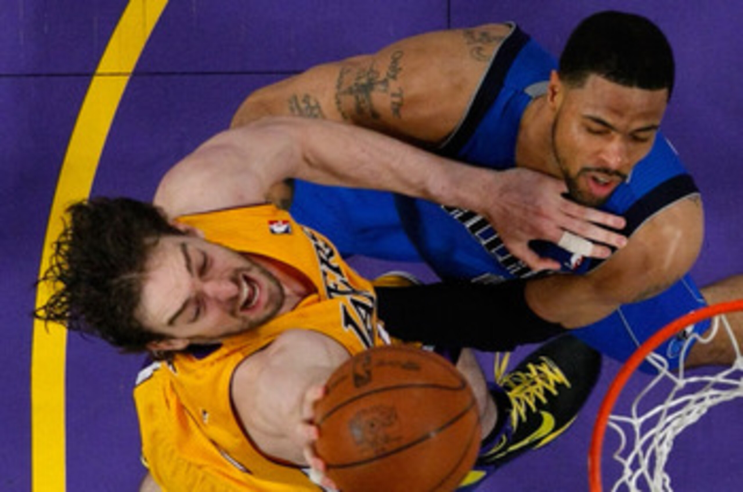 LOS ANGELES, CA - MAY 02:  Pau Gasol #16 of the Los Angeles Lakers dunks the ball over Tyson Chandler #6 of the Dallas Mavericks in the second half in Game One of the Western Conference Semifinals in the 2011 NBA Playoffs at Staples Center on May 2, 2011 