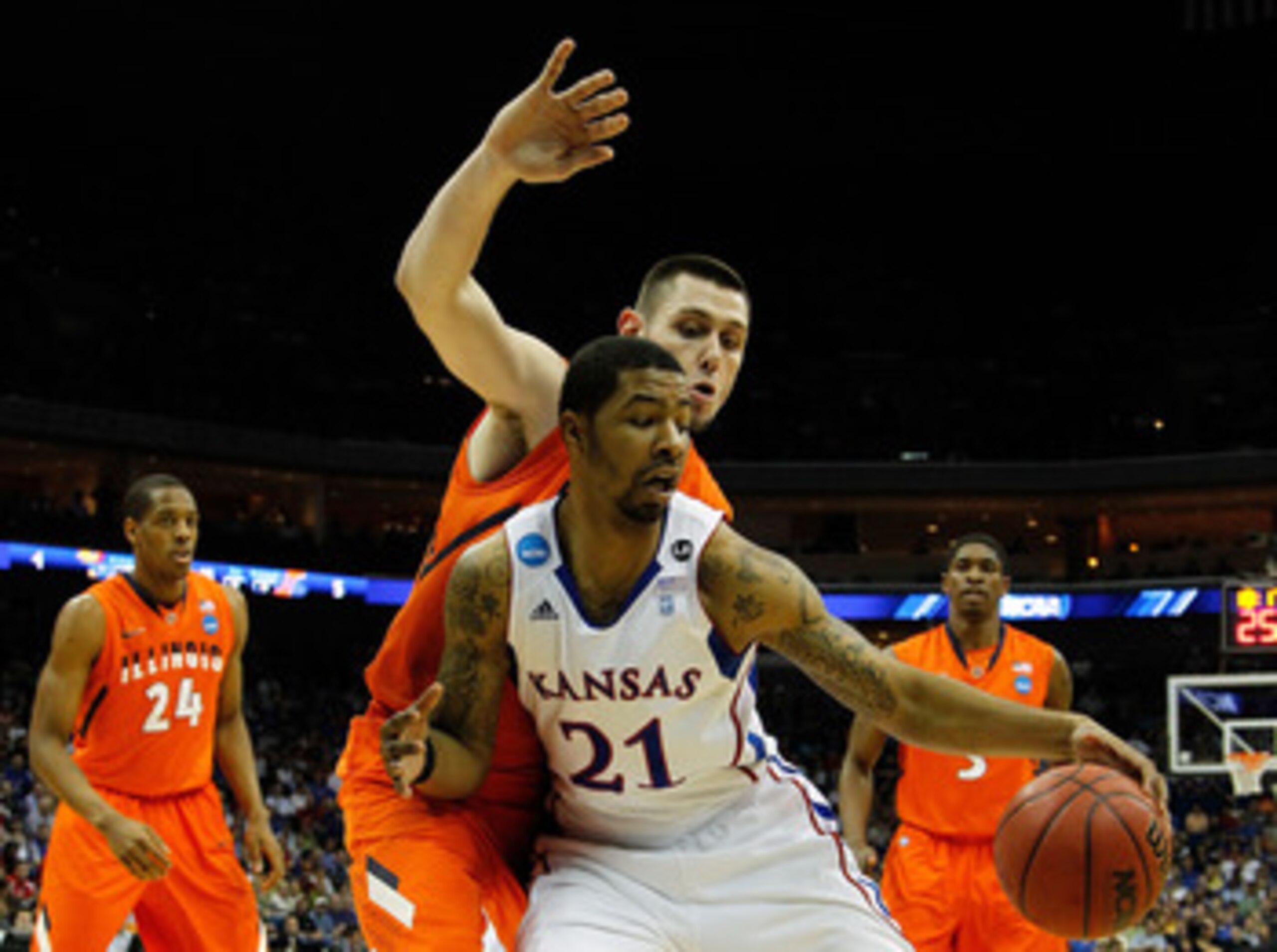 TULSA, OK - MARCH 20:  Markieff Morris #21 of the Kansas Jayhawks drives with the ball against Mike Tisdale #54 of the Illinois Fighting Illini during the third round of the 2011 NCAA men's basketball tournament at BOK Center on March 20, 2011 in Tulsa, O