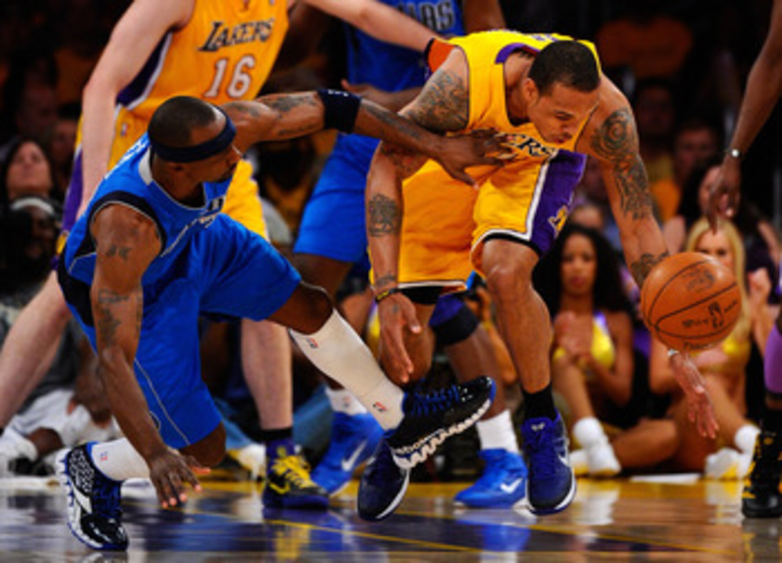 LOS ANGELES, CA - MAY 02:  Shannon Brown #12 of the Los Angeles Lakers goes after the ball as Jason Terry #31 of the Dallas Mavericks goes down next to him in the first quarter in Game One of the Western Conference Semifinals in the 2011 NBA Playoffs at S