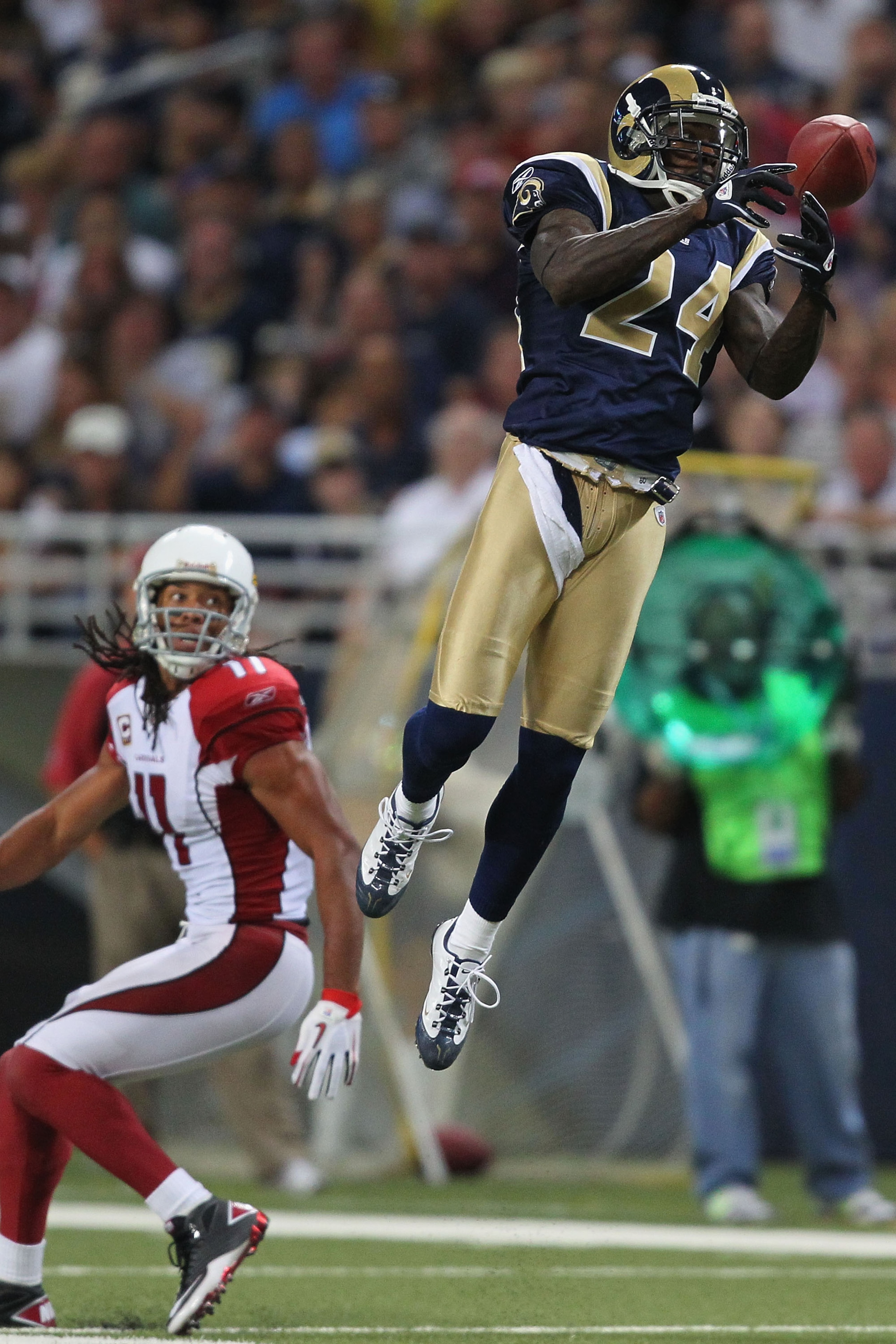 ST. LOUIS - SEPTEMBER 12: Ron Bartell #24 of the St. Louis Rams attempts to pick off a pass intended for Larry Fitzgerald #11 of the Arizona Cardinalsduring the NFL season opener at the Edward Jones Dome on September 12, 2010 in St. Louis, Missouri.  The 