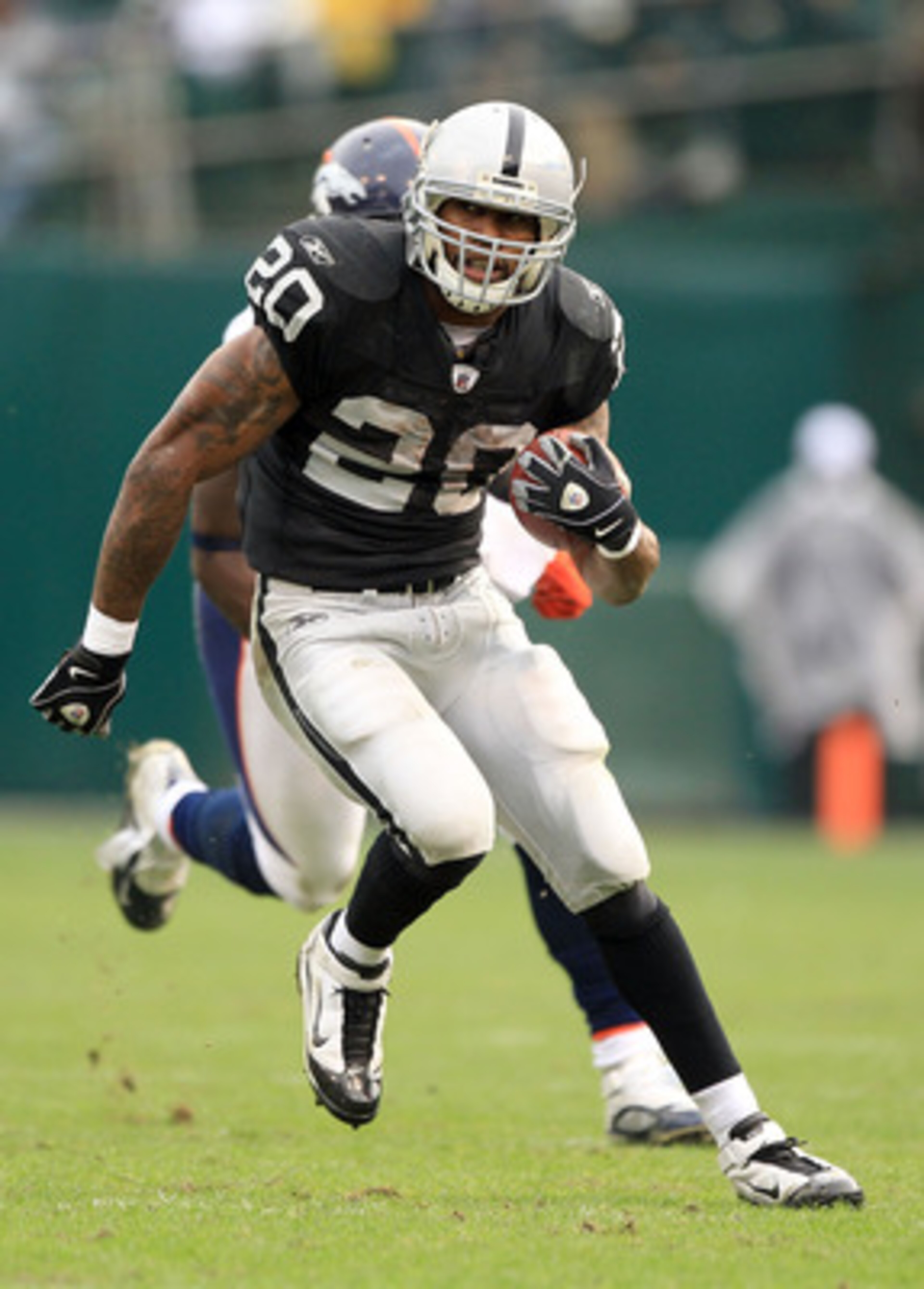 OAKLAND, CA - DECEMBER 19: Darren McFadden #20 of the Oakland Raiders runs with the ball during their game against the Denver Broncos at Oakland-Alameda County Coliseum on December 19, 2010 in Oakland, California. (Photo by Ezra Shaw/Getty Images) OAKLAND, CA - DECEMBER 19: Darren McFadden #20 of the Oakland Raiders runs with the ball during their game against the Denver Broncos at Oakland-Alameda County Coliseum on December 19, 2010 in Oakland, California. (Photo by Ezra Shaw/Getty Images)