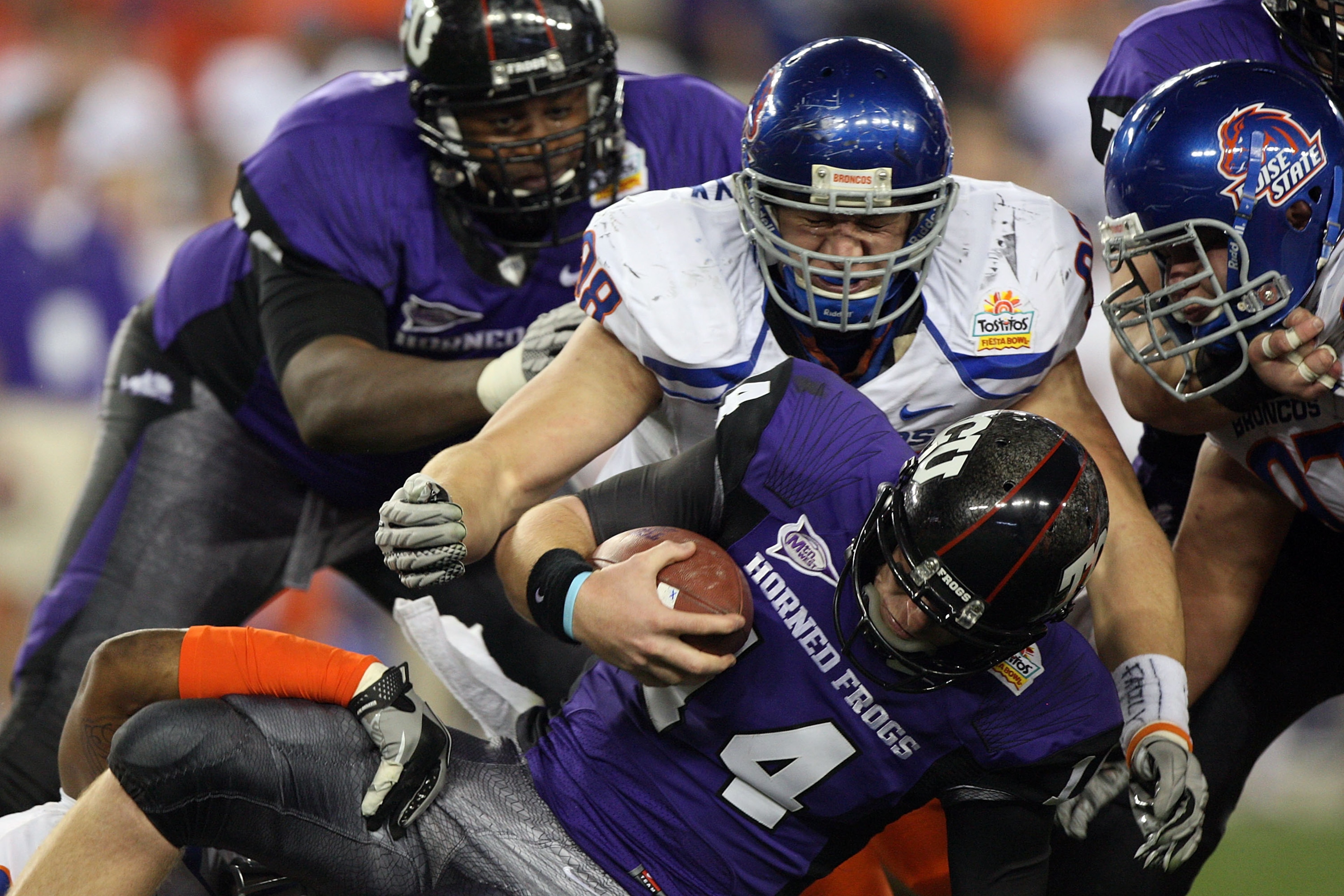 GLENDALE, AZ - JANUARY 04: Ryan Winterswyk #98 of the Boise State Broncos tackles quarterback Andy Dalton #14 of the TCU Horned Frogs on a quarterback keeper in the third quarter during the Tostitos Fiesta Bowl at the Universtity of Phoenix Stadium on Ja GLENDALE, AZ - JANUARY 04: Ryan Winterswyk #98 of the Boise State Broncos tackles quarterback Andy Dalton #14 of the TCU Horned Frogs on a quarterback keeper in the third quarter during the Tostitos Fiesta Bowl at the Universtity of Phoenix Stadium on Ja