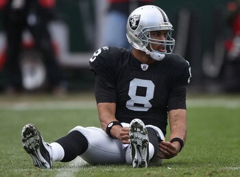 OAKLAND, CA - DECEMBER 26:  Jason Campbell #8 of the Oakland Raiders sits on the ground against the Indianapolis Colts during an NFL game at Oakland-Alameda County Coliseum on December  26, 2010 in Oakland, California.  (Photo by Jed Jacobsohn/Getty Image