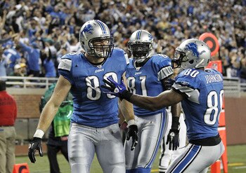 DETROIT, MI - DECEMBER 12:  Will Heller #89 of the Detroit Lions celebrates a for a fourth quarter touchdown with Bryant Johnson #80 and Calvin Johnson #81 while playing the Green Bay Packers on December 12, 2010 at Ford Field in Detroit, Michigan. Detroi