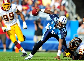 NASHVILLE, TN - NOVEMBER 21:  Quarterback Vince Young #10 of the Tennessee Titans scrambles away from H.B. Blades #54 of the Washington Redskins at LP Field on November 21, 2010 in Nashville, Tennessee. The Redskins won 19-16 in overtime.  (Photo by Grant