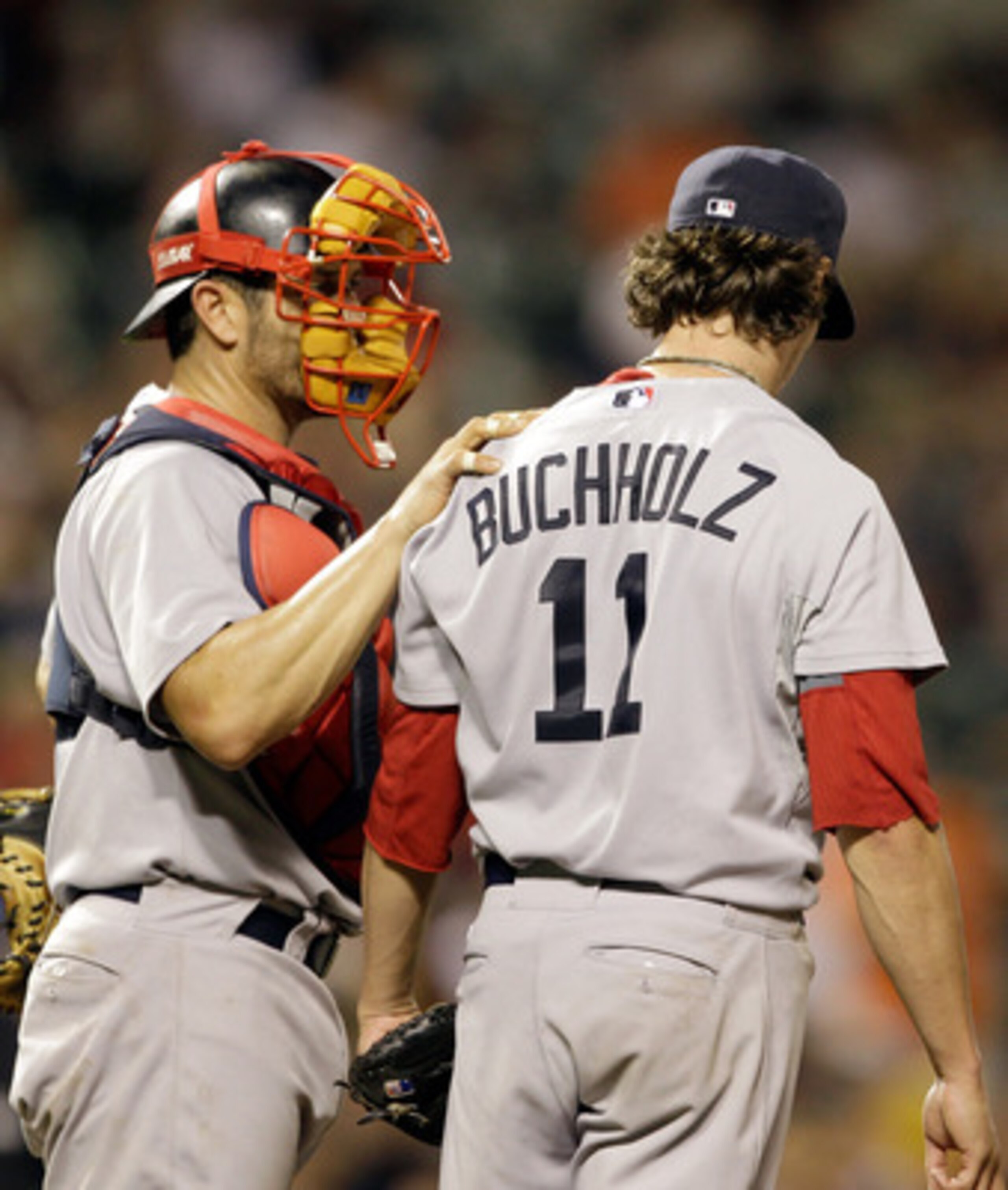 BALTIMORE, MD - APRIL 26: Catcher Jason Varitek #33 talks with starting pitcher Clay Buchholz #11 of the Boston Red Sox on the mound during the seventh inning of their game against the Baltimore Orioles at Oriole Park at Camden Yards on April 26, 2011 in 