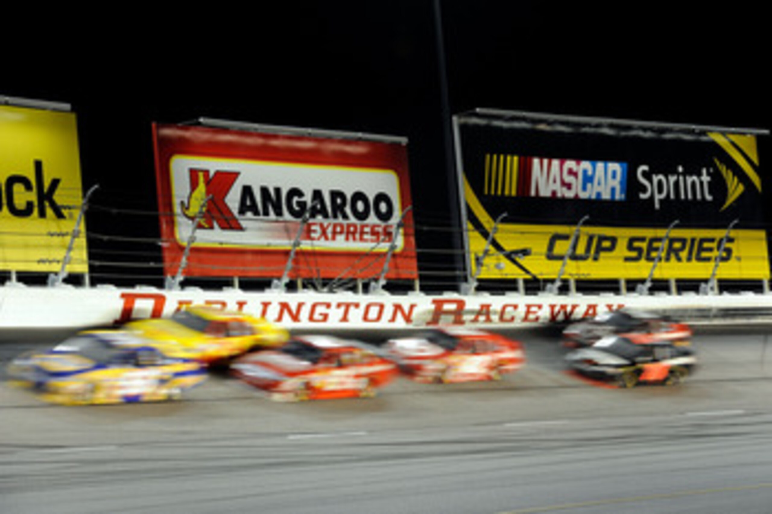 DARLINGTON, SC - MAY 08:  Michael McDowell, driver of the #55 PRISM Motorsports Toyota, races against Jeff Gordon, driver of the #24 DuPont / National Guard Facebook Chevrolet and Brian Vickers, driver of the #83 Red Bull Toyota, during the NASCAR Sprint 