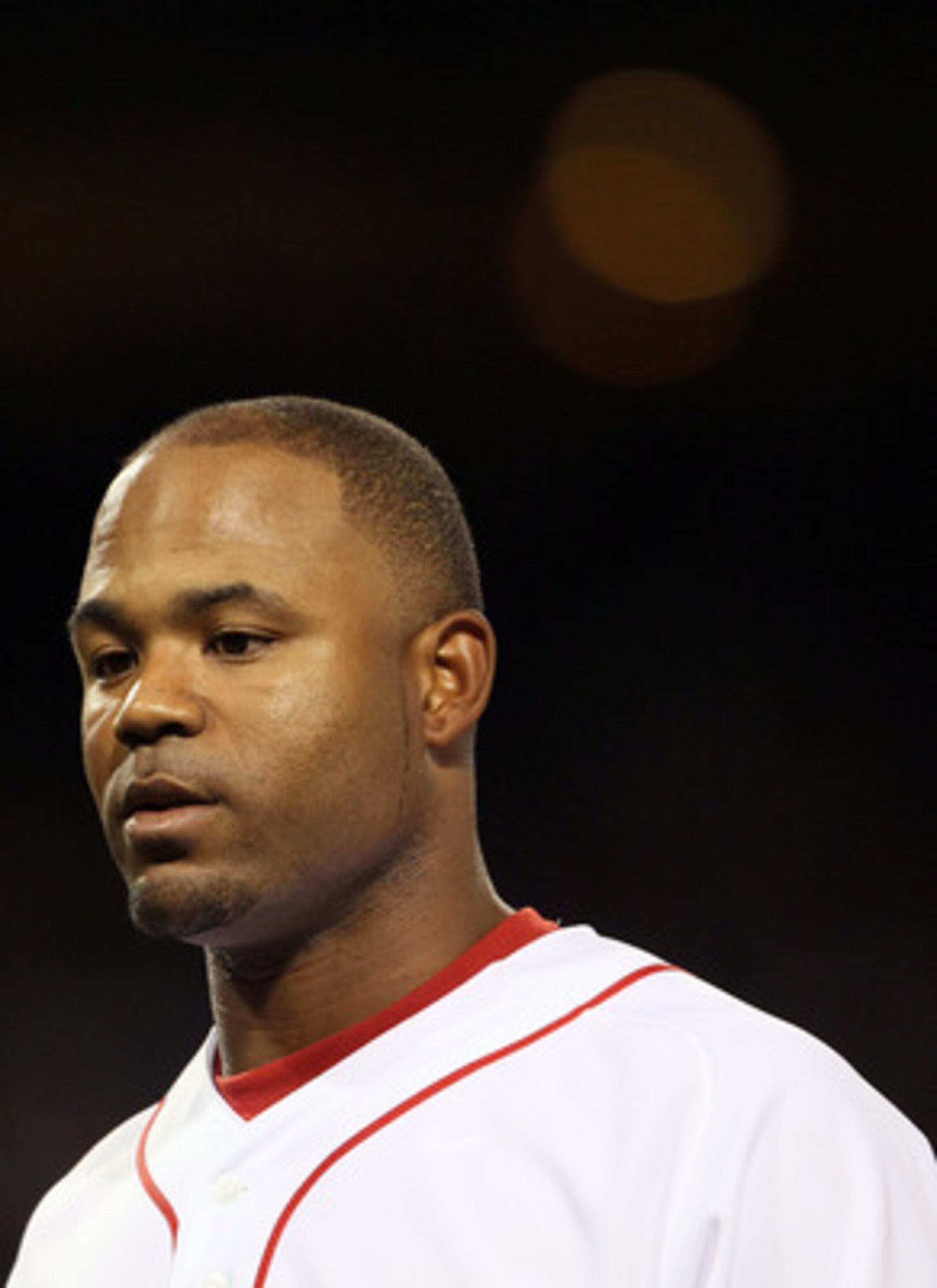BOSTON, MA - APRIL 30:  Carl Crawford #13 of the Boston Red Sox heads back to the dugout after he was out at first base against the Seattle Mariners on April 30, 2011 at Fenway Park in Boston, Massachusetts.  (Photo by Elsa/Getty Images)