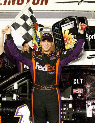 DARLINGTON, SC - MAY 08:  Denny Hamlin, driver of the #11 FedEx Express Toyota, celebrates in victory lane after he won the NASCAR Sprint Cup series SHOWTIME Southern 500 at Darlington Raceway on May 8, 2010 in Darlington, South Carolina.  (Photo by Jason
