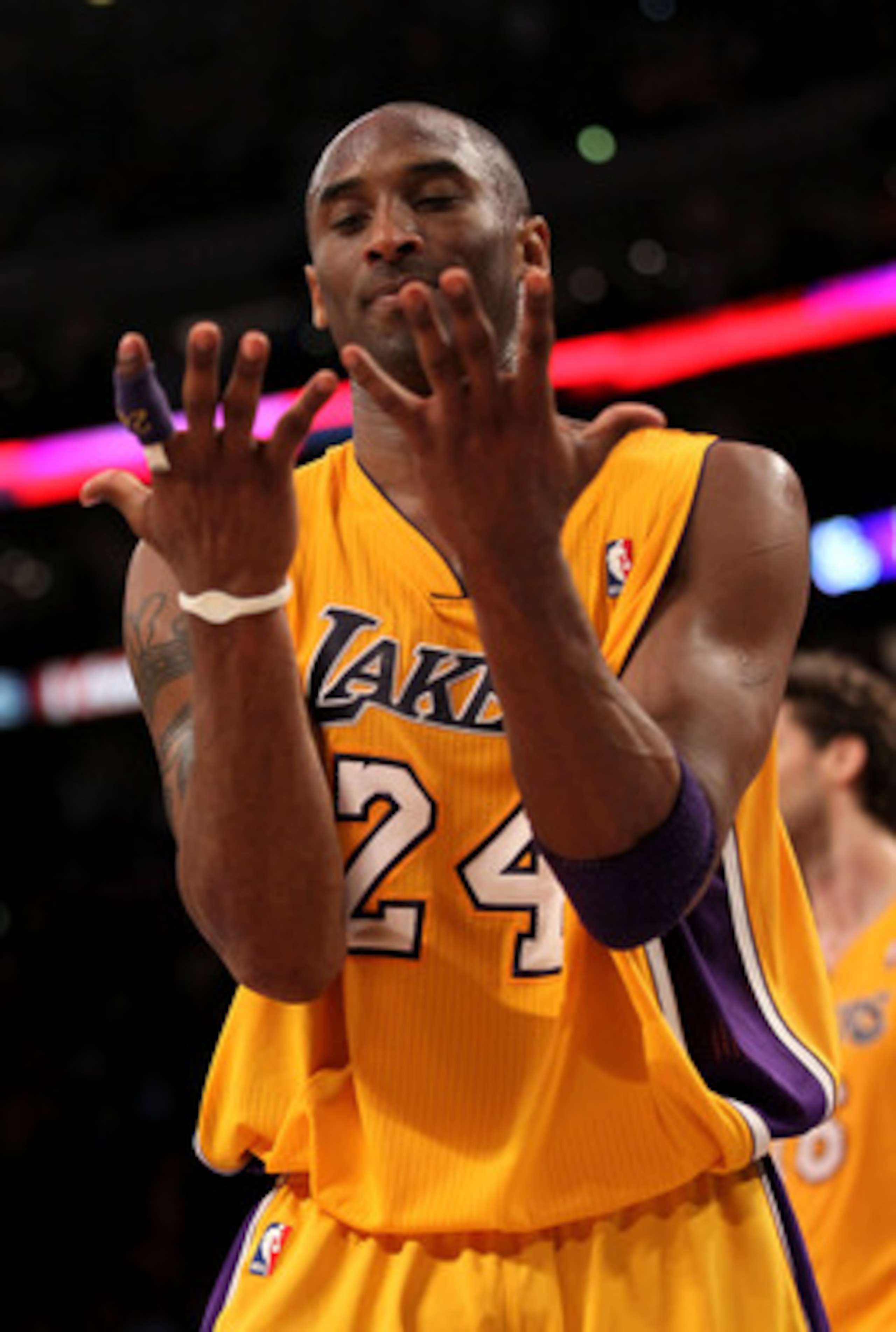 LOS ANGELES, CA - APRIL 5: Kobe Bryant #24 of the Los Angeles Lakers looks at his hands as he walks off the court after losing control of the ball while going for the potential game winning shot in the final seconds against the Utah Jazz at Staples Cente LOS ANGELES, CA - APRIL 5: Kobe Bryant #24 of the Los Angeles Lakers looks at his hands as he walks off the court after losing control of the ball while going for the potential game winning shot in the final seconds against the Utah Jazz at Staples Cente