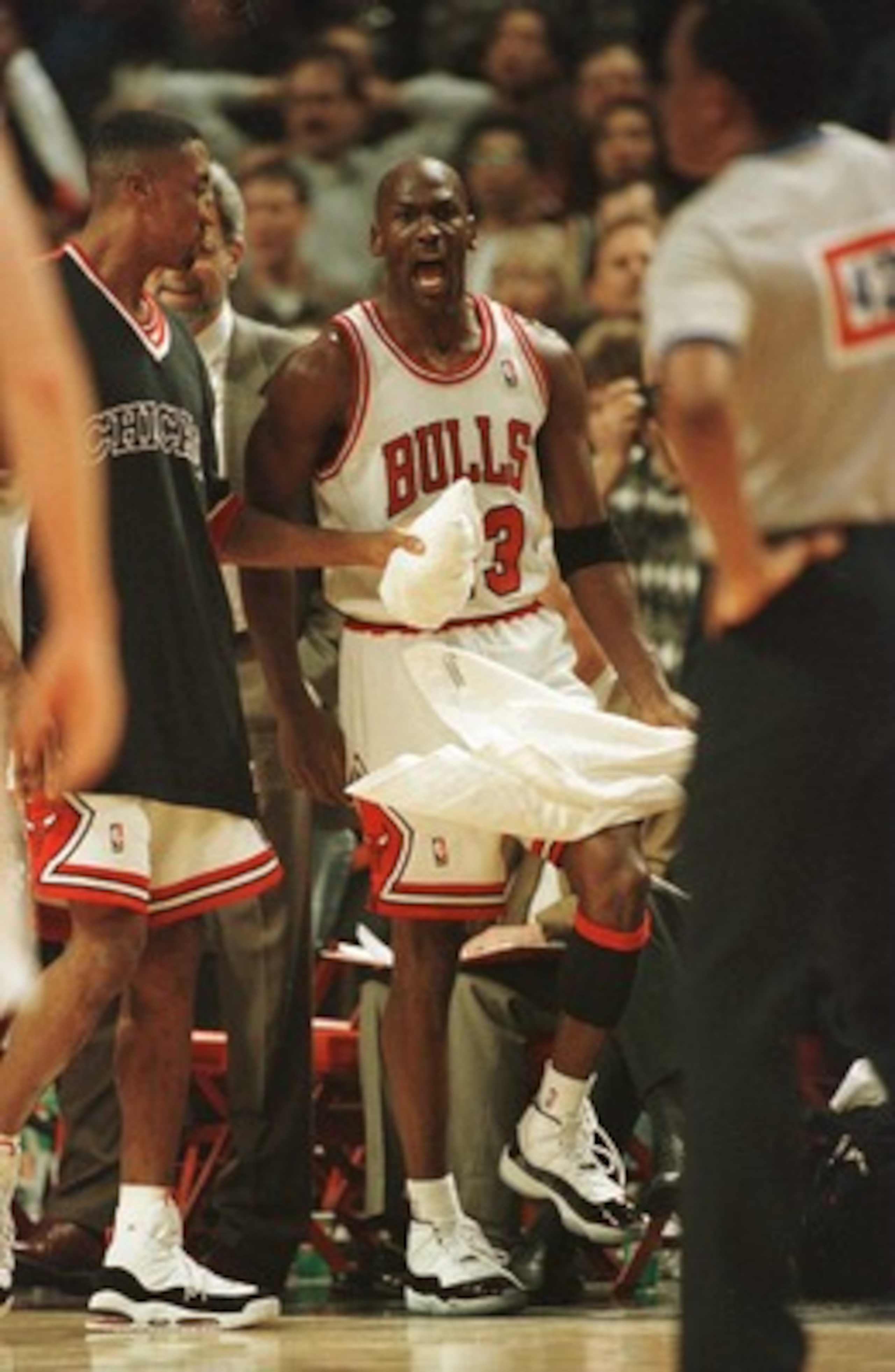 20 Apr 1996: As teammate Scottie Pippen holds him back, guard Michael Jordan of the Chicago Bulls has words for referee Hugh Hollins, foreground, who called a foul on Jordan with .05 seconds to go in the game allowing Indiana Pacer Eddie Johnson to makea 20 Apr 1996: As teammate Scottie Pippen holds him back, guard Michael Jordan of the Chicago Bulls has words for referee Hugh Hollins, foreground, who called a foul on Jordan with .05 seconds to go in the game allowing Indiana Pacer Eddie Johnson to makea