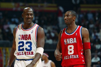 ATLANTA - FEBRUARY 9:  Michael Jordan (Washington Wizards) #23 of the Eastern Conference All-Stars talks with Kobe Bryant (Los Angeles Lakers) #8 of the Western Conference All-Stars at the 2003 NBA All-Star Game on February 9, 2003 at Philips Arena in Atl