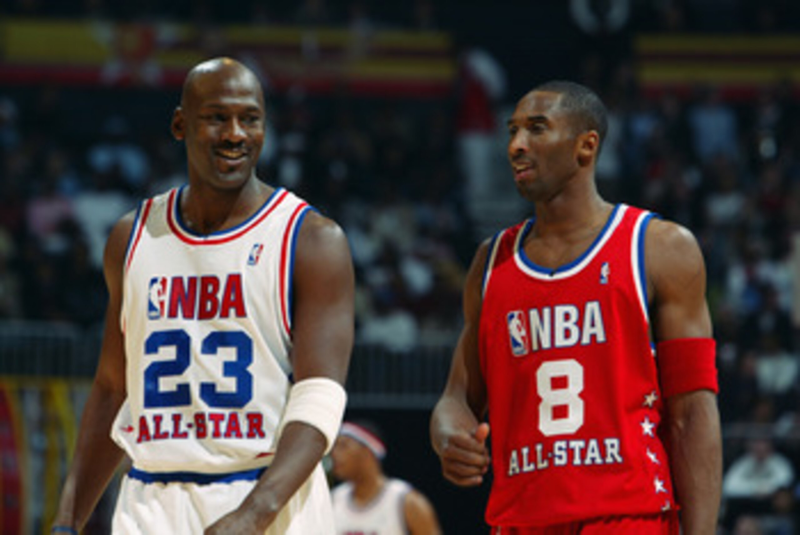 ATLANTA - FEBRUARY 9: Michael Jordan (Washington Wizards) #23 of the Eastern Conference All-Stars talks with Kobe Bryant (Los Angeles Lakers) #8 of the Western Conference All-Stars at the 2003 NBA All-Star Game on February 9, 2003 at Philips Arena in Atl ATLANTA - FEBRUARY 9: Michael Jordan (Washington Wizards) #23 of the Eastern Conference All-Stars talks with Kobe Bryant (Los Angeles Lakers) #8 of the Western Conference All-Stars at the 2003 NBA All-Star Game on February 9, 2003 at Philips Arena in Atl
