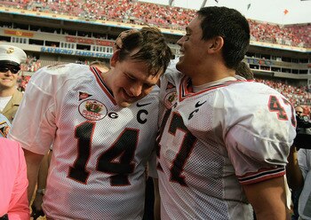 TAMPA, FL-  JANUARY 1:  David Greene #14 and David Pollack #47 of the Georgia Bulldogs celebrate following the Outback Bowl game against the Wisconsin Badgers at Raymond James Stadium on January 1, 2005 in Tampa, Florida. Georgia won the game 24-21. (Phot