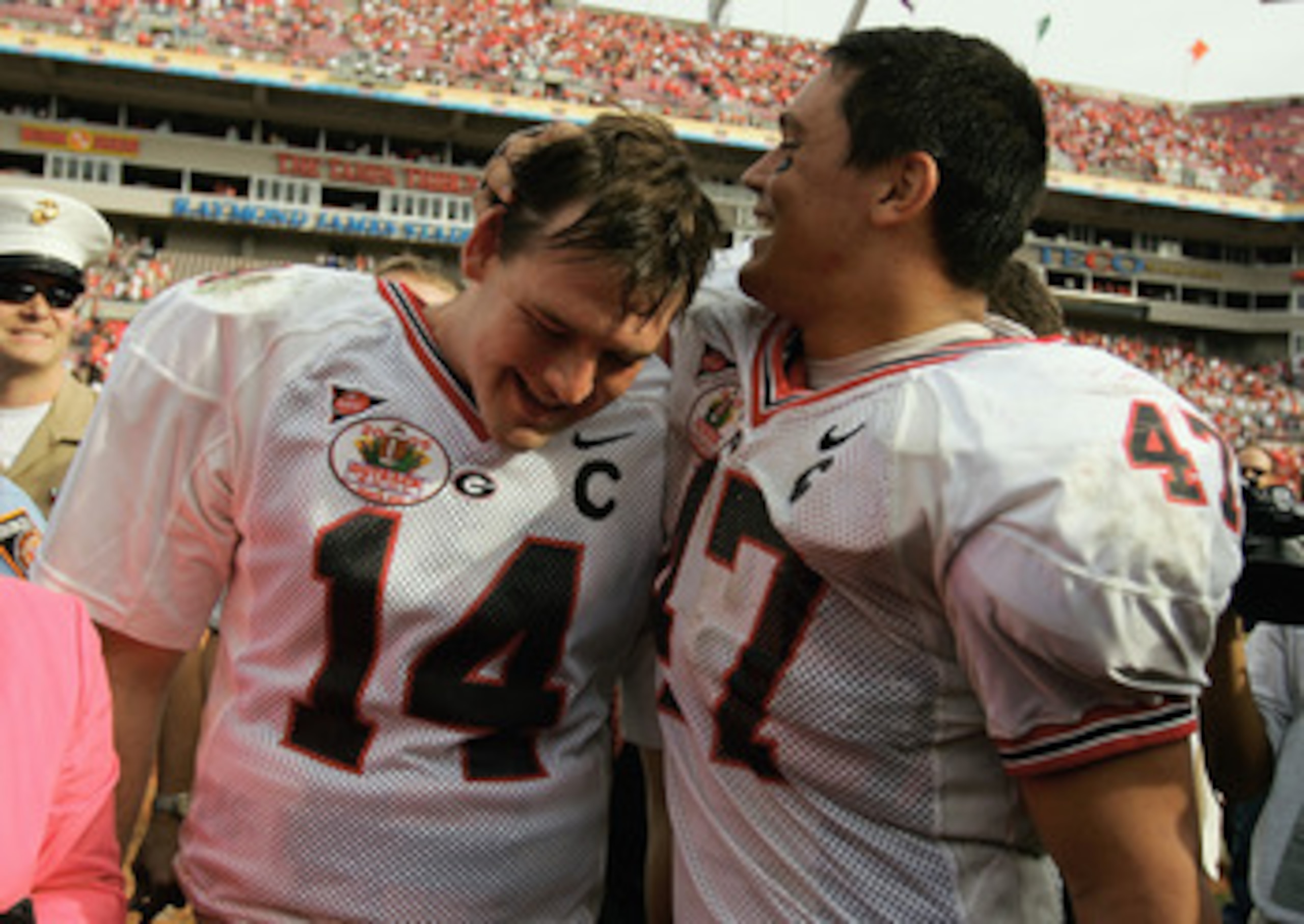 TAMPA, FL-  JANUARY 1:  David Greene #14 and David Pollack #47 of the Georgia Bulldogs celebrate following the Outback Bowl game against the Wisconsin Badgers at Raymond James Stadium on January 1, 2005 in Tampa, Florida. Georgia won the game 24-21. (Phot