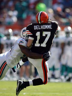 MIAMI - DECEMBER 05: Quarterback Jake Delhomme #17 of the Cleveland Browns is hit by Cameron Wake #91 of the Miami Dolphins at Sun Life Stadium on December 5, 2010 in Miami, Florida.  (Photo by Marc Serota/Getty Images)