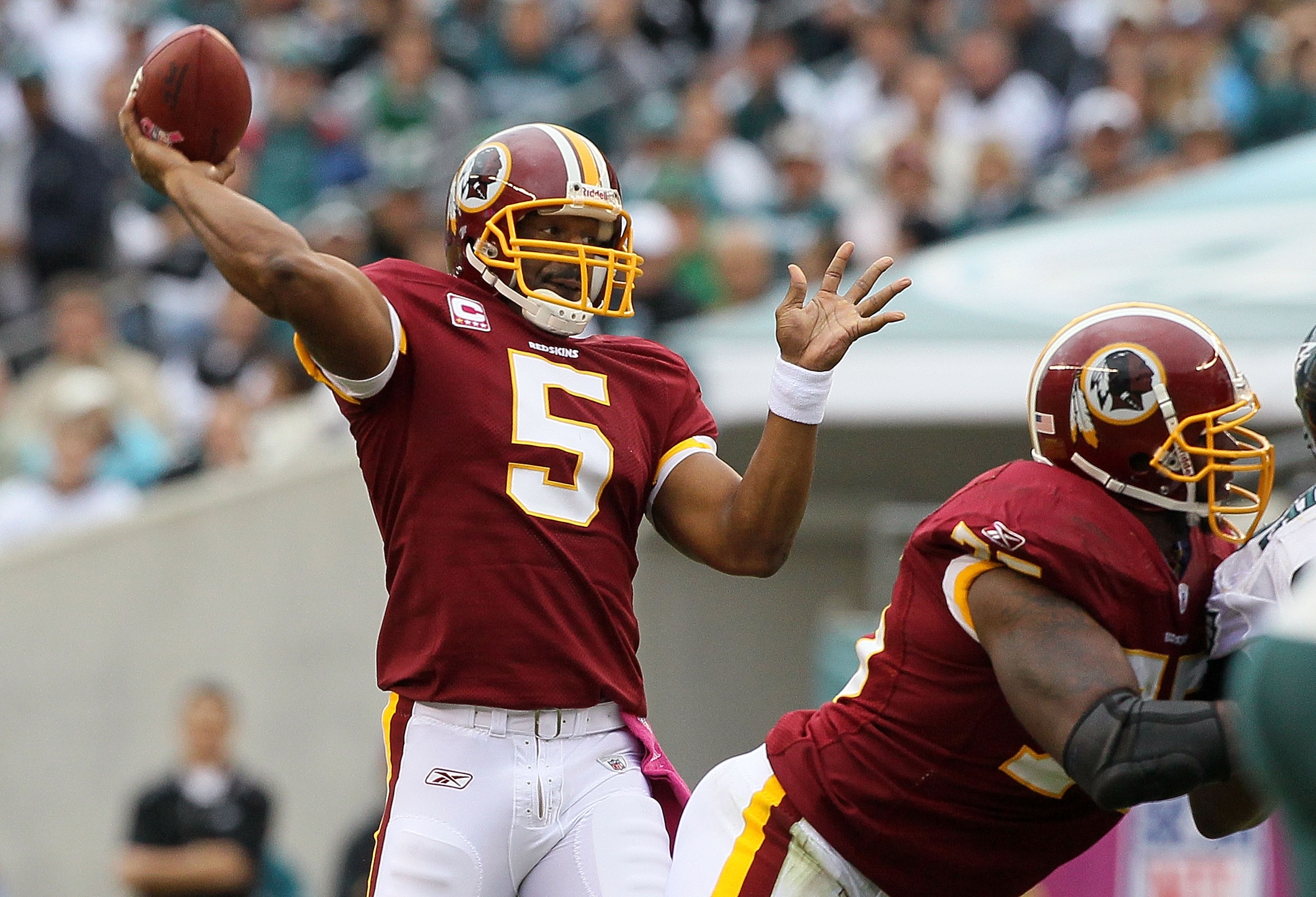 PHILADELPHIA - OCTOBER 03:  Donovan McNabb #5 of the Washington Redskins throws a first quater touchdown pass against the Philadelphia Eagles to teammate Chris Cooley (not pictured) on October 3, 2010 at Lincoln Financial Field in Philadelphia, Pennsylvan