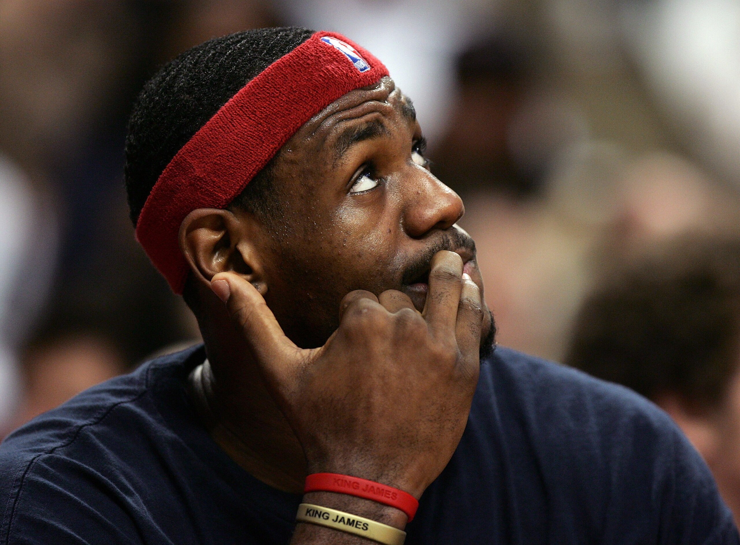 CHICAGO - DECEMBER 22:  LeBron James #23 of the Cleveland Cavaliers watches the replay board and bites his nails while sitting on the bench during a game against the Chicago Bulls on December 22, 2005 at the United Center in Chicago, Illinois.  NOTE TO US