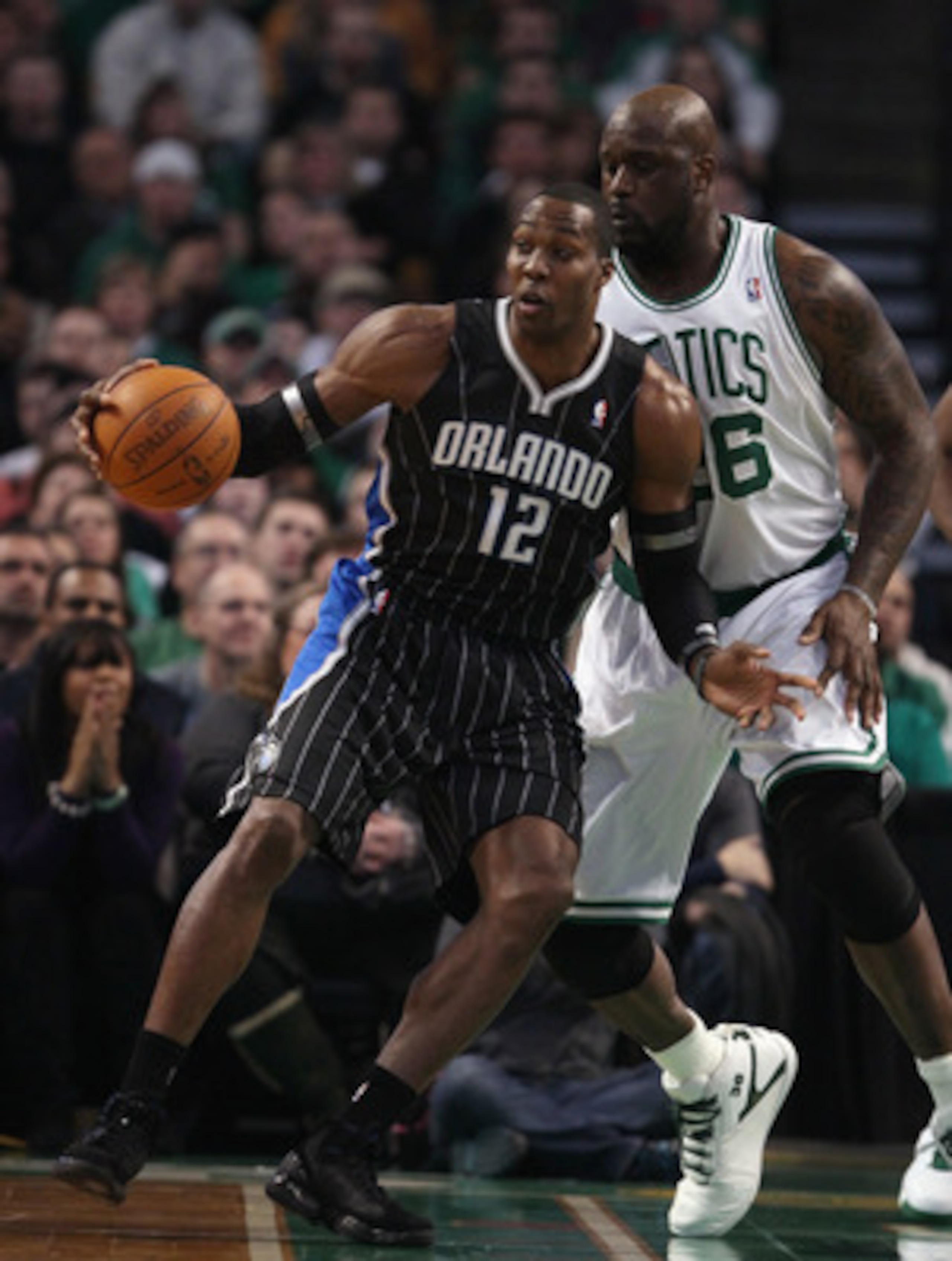 BOSTON, MA - JANUARY 17:  Dwight Howard #12 of the Orlando Magic tries to get around Shaquille O'Neal #36 of the Boston Celtics on January 17, 2011 at the TD Garden in Boston, Massachusetts.  NOTE TO USER: User expressly acknowledges and agrees that, by d