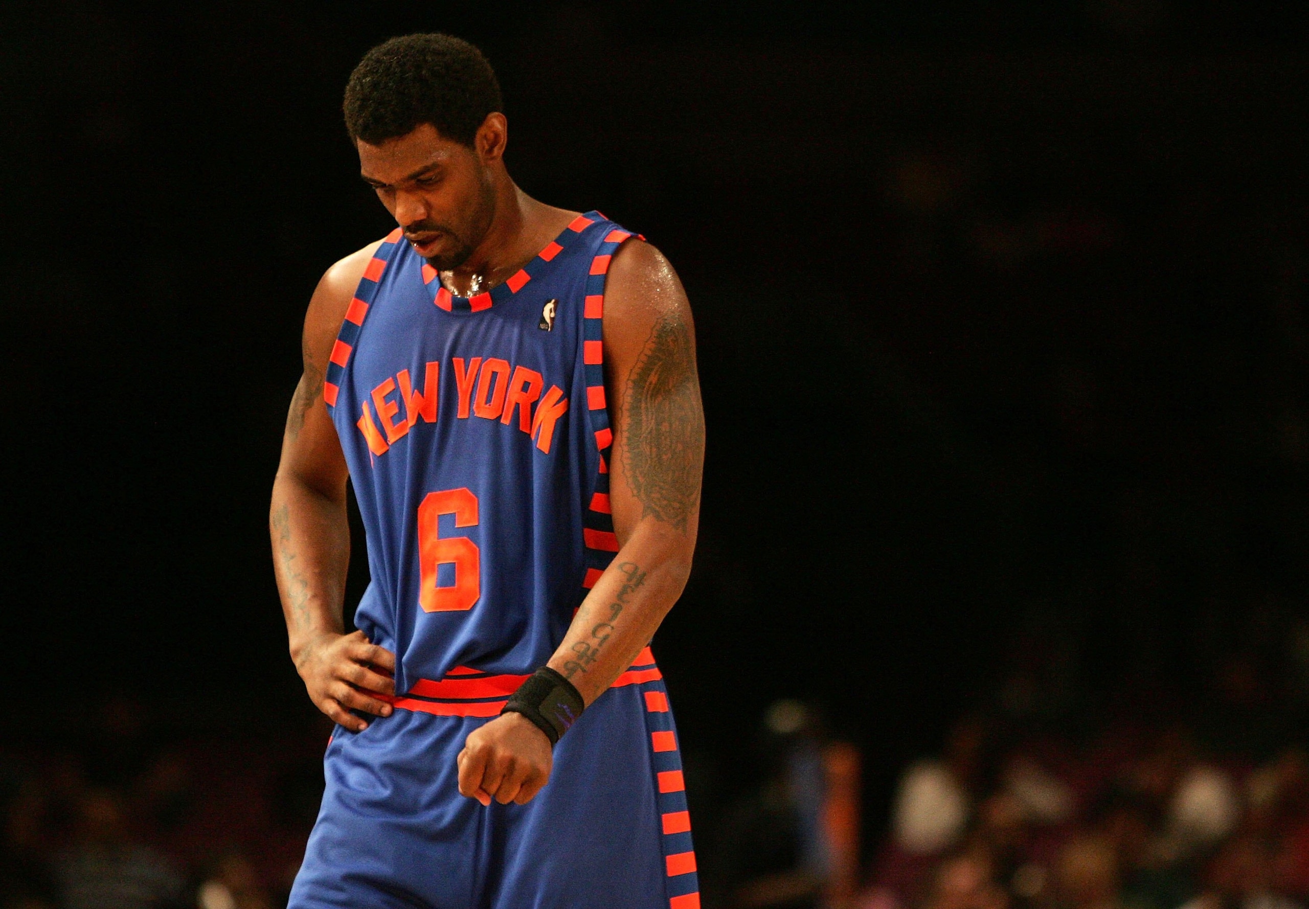 NEW YORK - MARCH 29:  Qyntel Woods #6 of the New York Knicks walks with his head down against the Boston Celtics on March 29, 2006 at Madison Square Garden in New York City.  NOTE TO USER: User expressly acknowledges and agrees that, by downloading and or