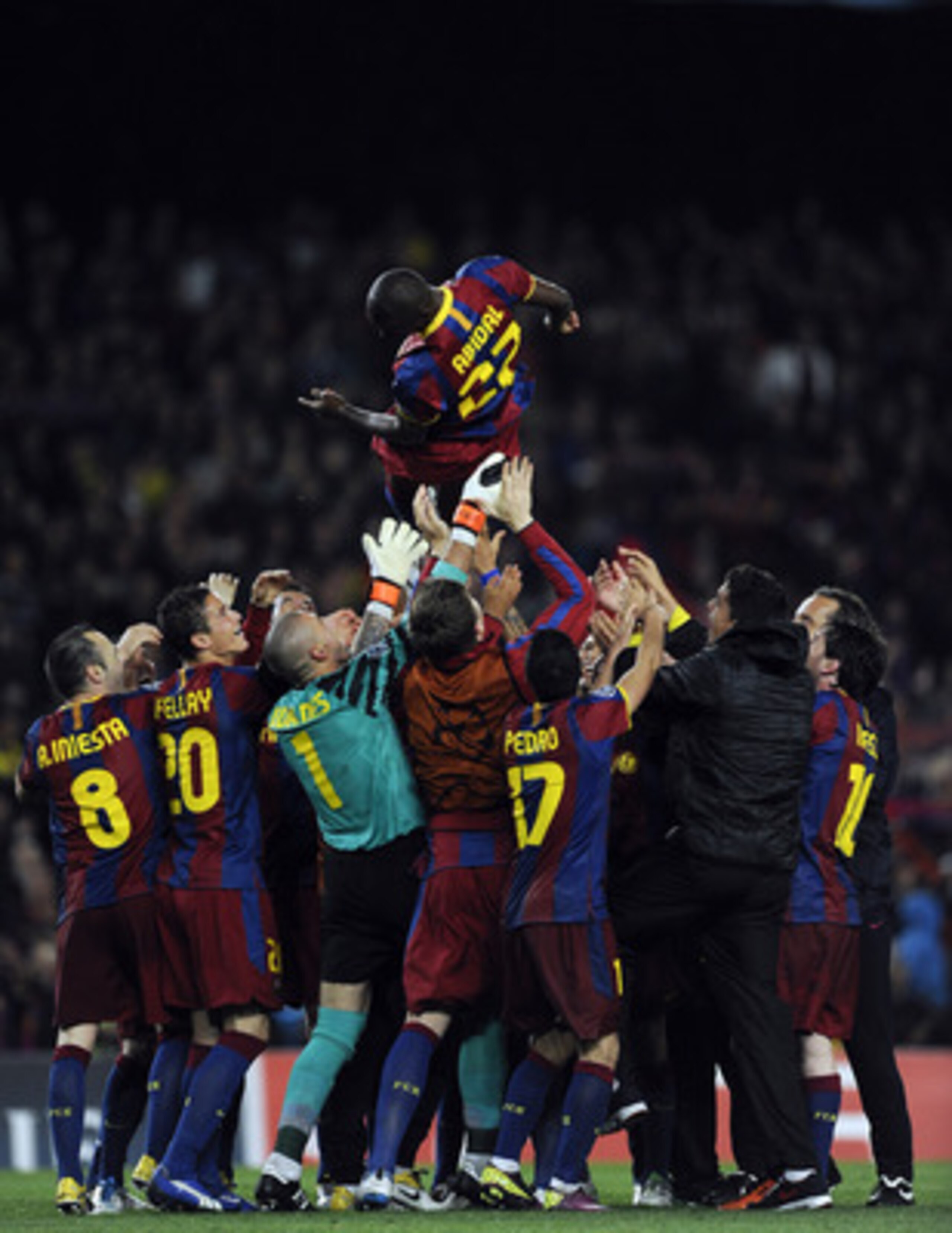 BARCELONA, SPAIN - MAY 03:  FC Barcelona players lift his teammate Eric Abidal after defeating real Madrid at the end of the UEFA Champions League Semi Final second leg match between Barcelona and Real Madrid at the Camp Nou on May 3, 2011 in Barcelona, S