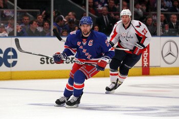 NEW YORK, NY - APRIL 17:  Chris Drury #23 of the New York Rangers skates against Mike Knuble #22 of the Washington Capitals in Game Three of the Eastern Conference Quarterfinals during the 2011 NHL Stanley Cup Playoffs at Madison Square Garden on April 17