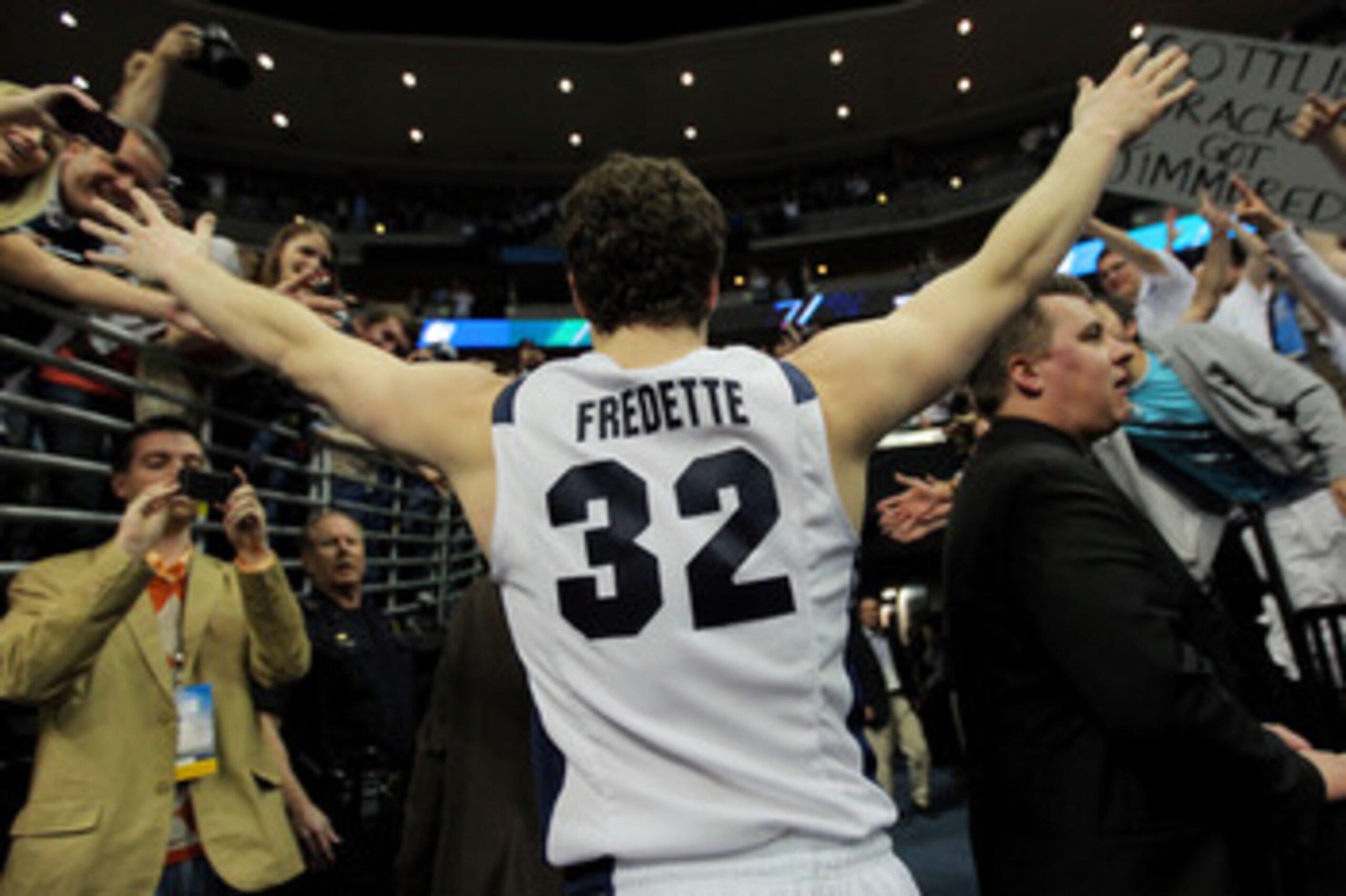 DENVER, CO - MARCH 19:  Jimmer Fredette #32 of the Brigham Young Cougars runs off of the court after defeating the Gonzaga Bulldogs during the third round of the 2011 NCAA men's basketball tournament at Pepsi Center on March 19, 2011 in Denver, Colorado.