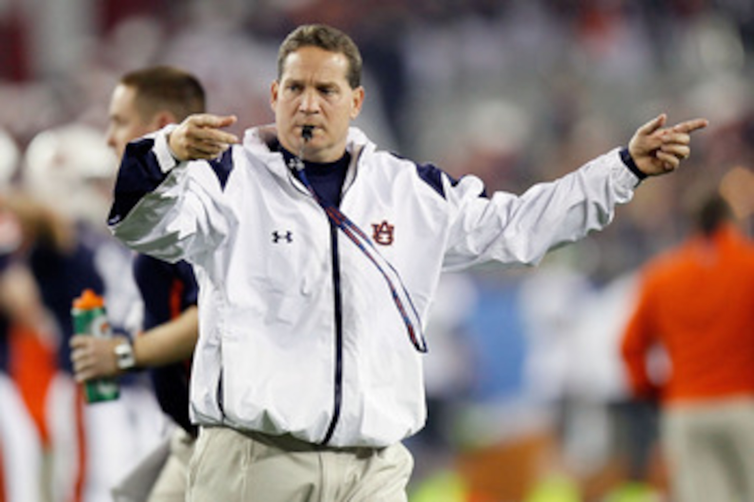 GLENDALE, AZ - JANUARY 10:  Head coach Gene Chizik of the Auburn Tigers directs his team before taking on the Oregon Ducks during the Tostitos BCS National Championship Game at University of Phoenix Stadium on January 10, 2011 in Glendale, Arizona.  (Phot