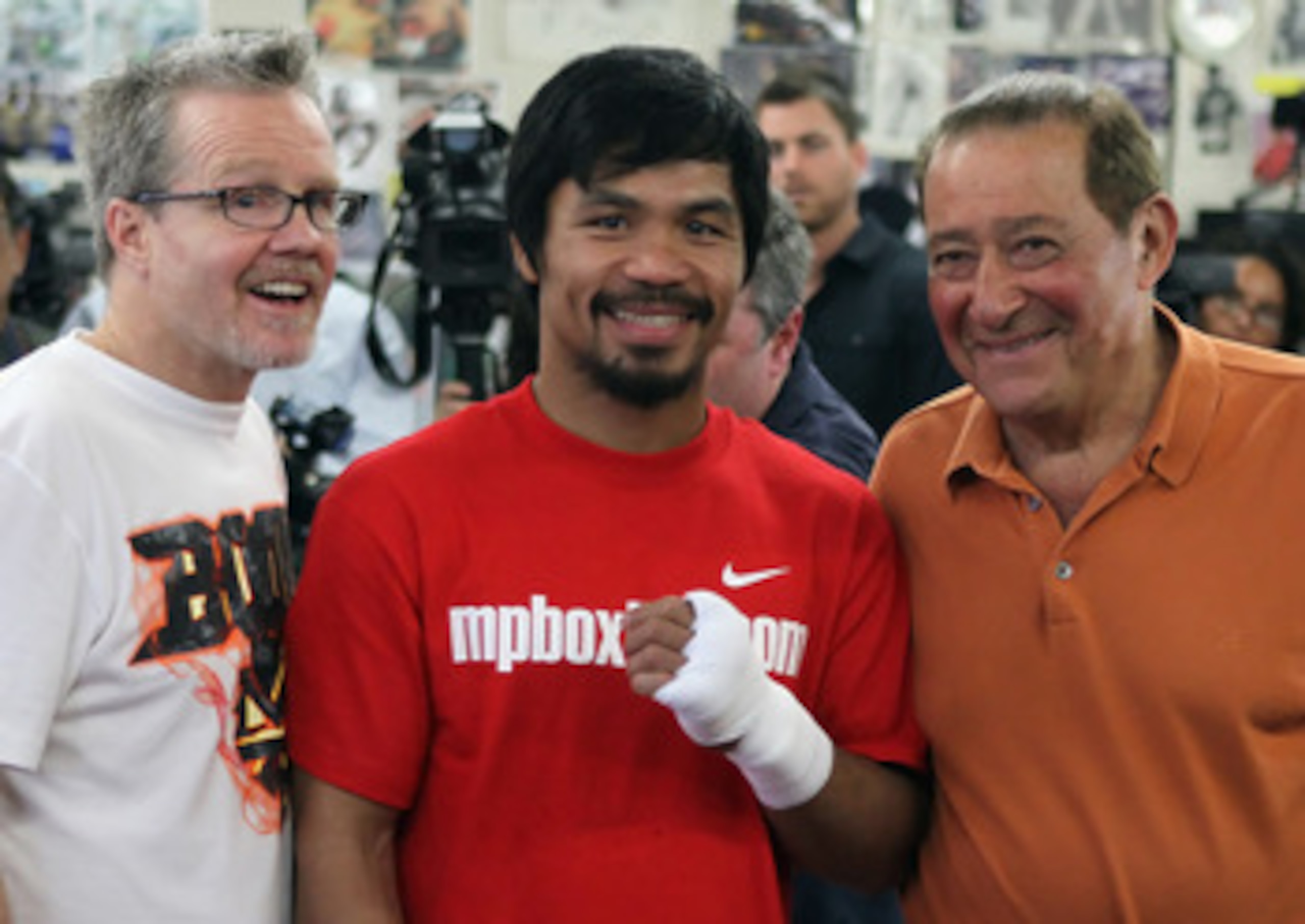 HOLLYWOOD, CA - APRIL 20:  Manny Pacquiao of the Philippines (C) poses with his coach Teddy Roach (L) and promoter Bob Arum (R) during a media workout at the Wild Card Boxing Club on April 20, 2011 in Hollywood, California.  (Photo by Jeff Gross/Getty Ima