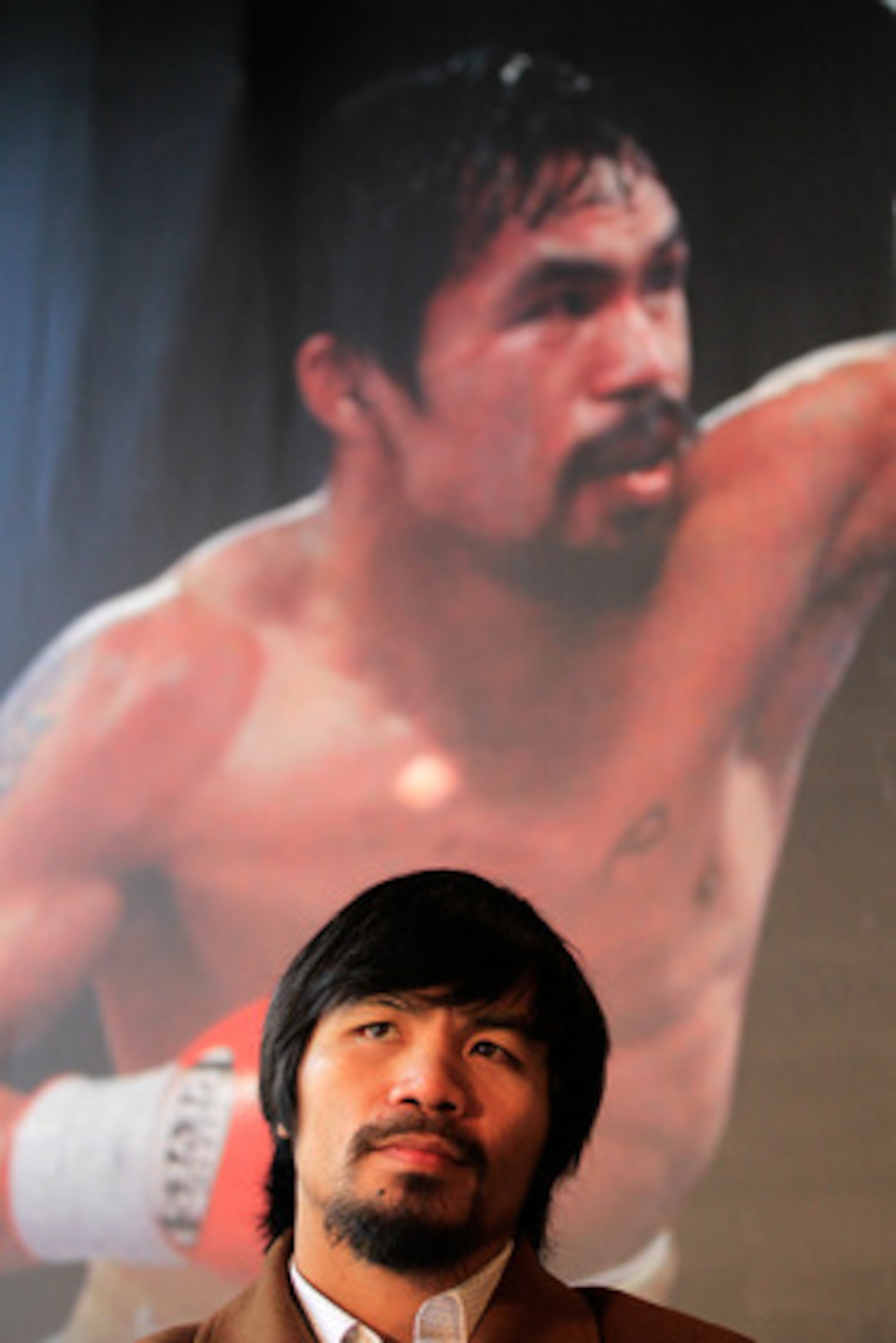 NEW YORK, NY - FEBRUARY 14:  Manny Pacquiao looks on at a press conference to promote his upcoming fight with Shane Mosley at The Lighthouse at Chelsea Piers on February 14, 2011 in New York City.  (Photo by Chris Trotman/Getty Images)