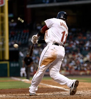 HOUSTON - APRIL 30:  Jason Bourgeois #11 of the Houston Astros doubles on a line drive to left field in the fifth inning against the Milwaukee Brewers at Minute Maid Park on April 30, 2011 in Houston, Texas.  (Photo by Bob Levey/Getty Images)
