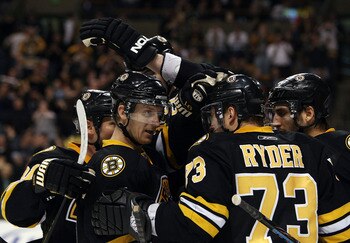 BOSTON - FEBRUARY 24: Michael Ryder #73 of the Boston Bruins is congratulated by teammates P.J. Axelsson #11, Patrice Bergeron #37 and Marc Savard #91 after Ryder scored a goal in the third period against the Florida Panthers on February 24, 2009 at the BOSTON - FEBRUARY 24: Michael Ryder #73 of the Boston Bruins is congratulated by teammates P.J. Axelsson #11, Patrice Bergeron #37 and Marc Savard #91 after Ryder scored a goal in the third period against the Florida Panthers on February 24, 2009 at the