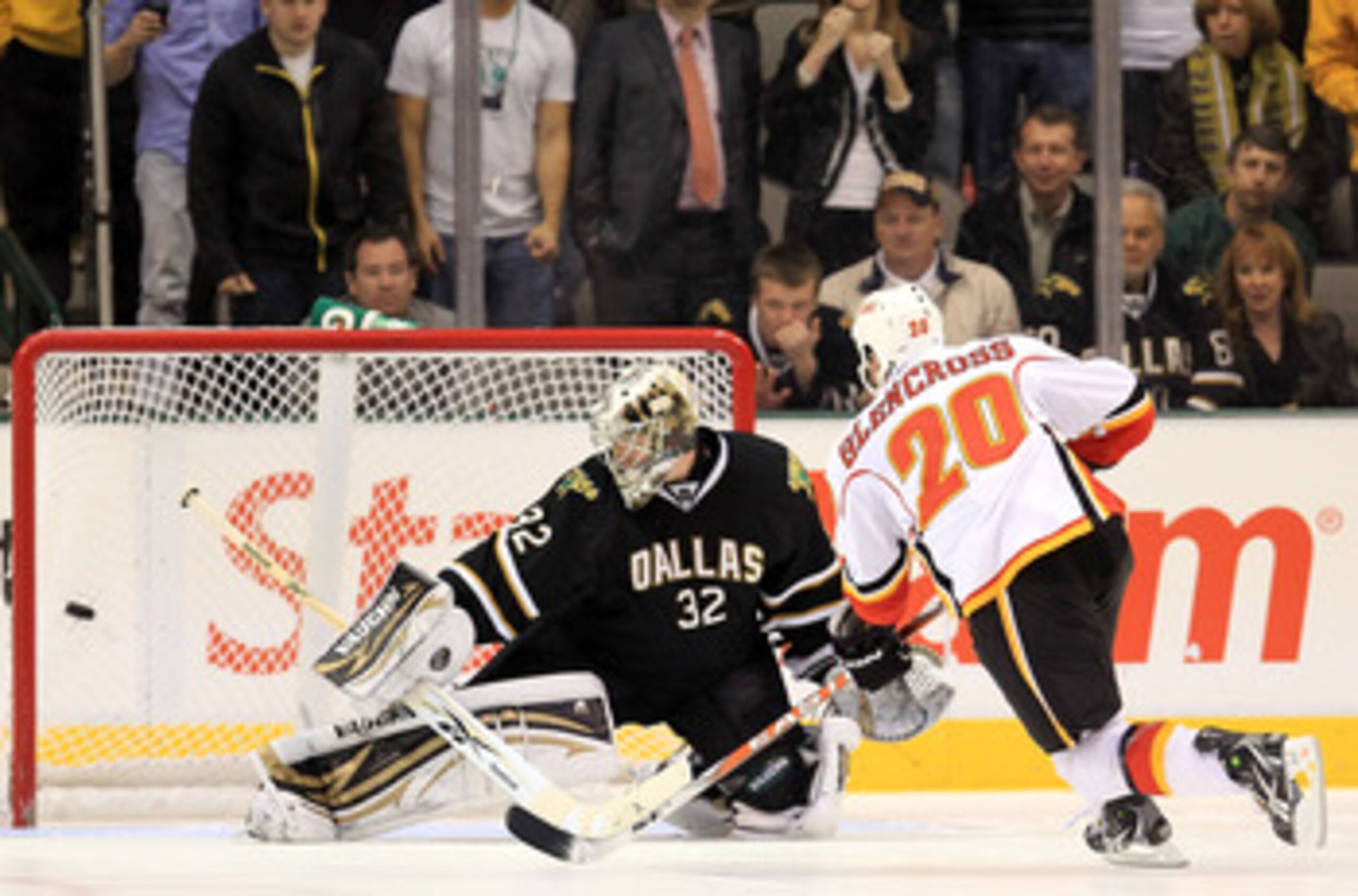 DALLAS, TX - MARCH 09:  Left wing Curtis Glencross #20 of the Calgary Flames scores the game winning goal in the shootout against Kari Lehtonen #32 of the Dallas Stars at American Airlines Center on March 9, 2011 in Dallas, Texas.  (Photo by Ronald Martin