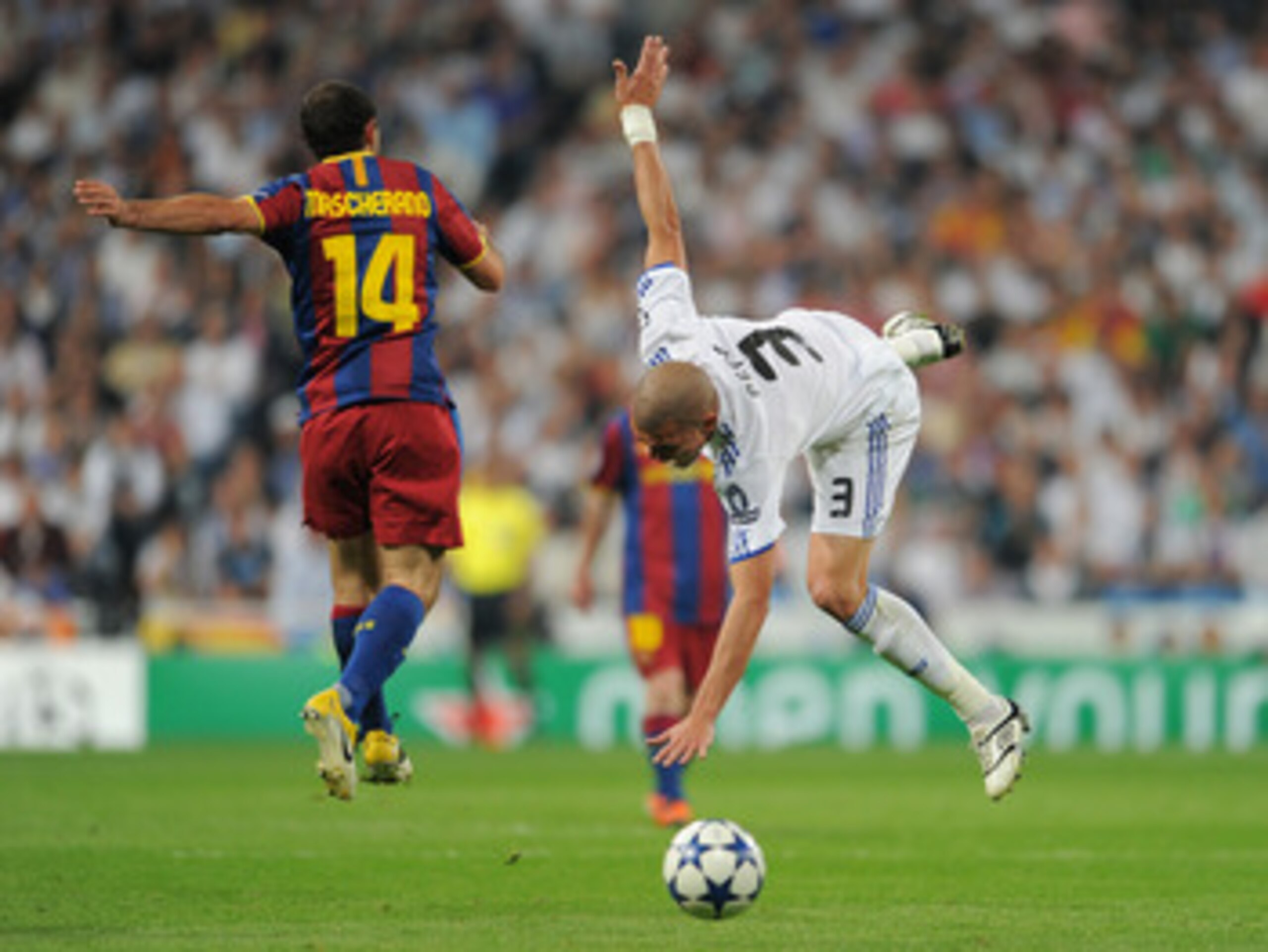 MADRID, SPAIN - APRIL 27:  Pepe (R) of Real Madrid is fouled by Javier Mascherano of Barcelona during the UEFA Champions League Semi Final first leg match between Real Madrid and Barcelona at the Estadio Santiago Bernabeu on April 27, 2011 in Madrid, Spai