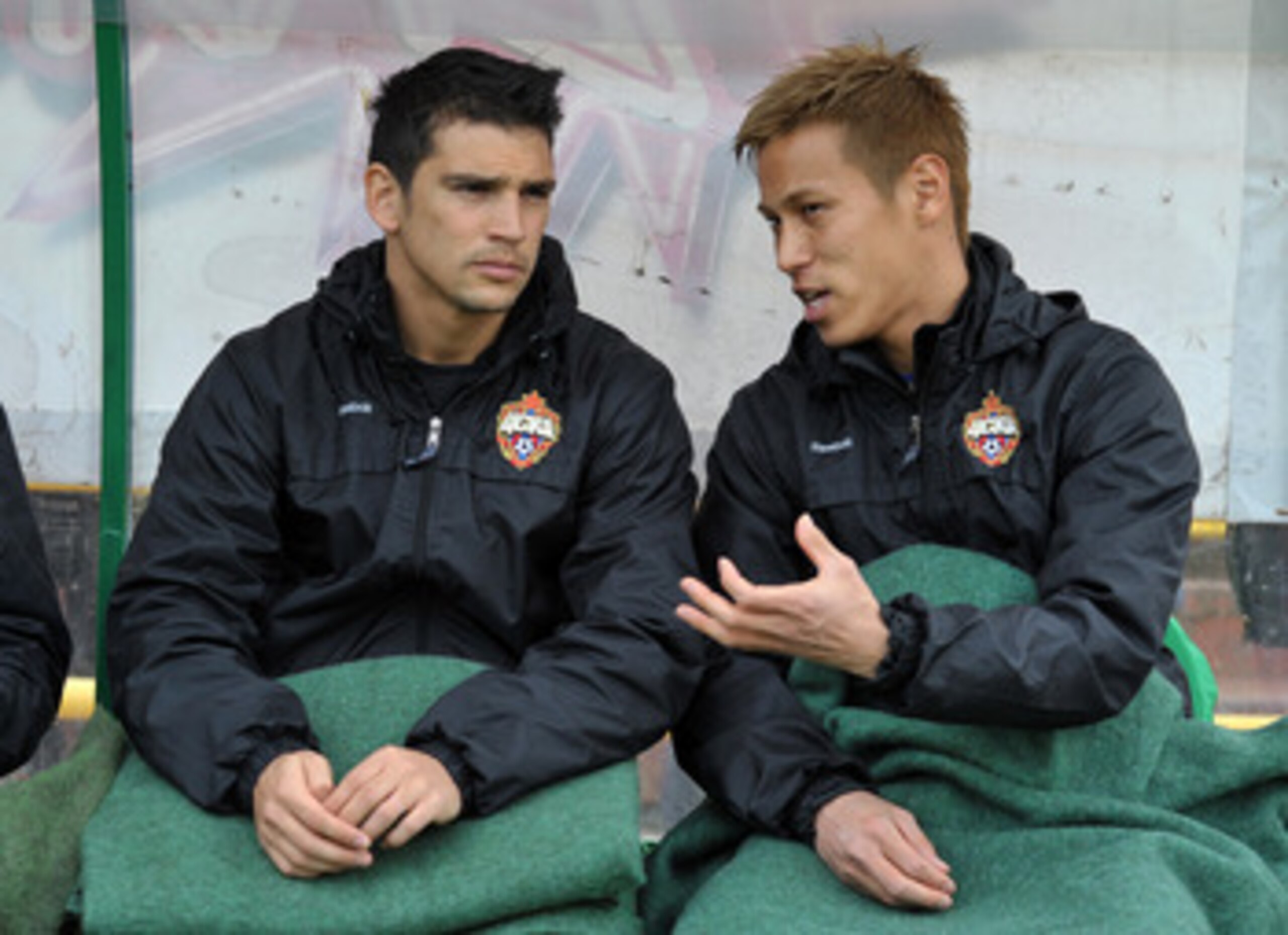 TOMSK, RUSSIA - APRIL 24: (EMBARGOED FOR PUBLICATION IN ALL JAPANESE MEDIA UNTIL 48 HOURS AFTER CREATE DATE AND TIME) Keisuke Honda (R) of PFC CSKA Moscow is seen on the bench during the Russian Football League Championship match between FC Tom Tomsk and